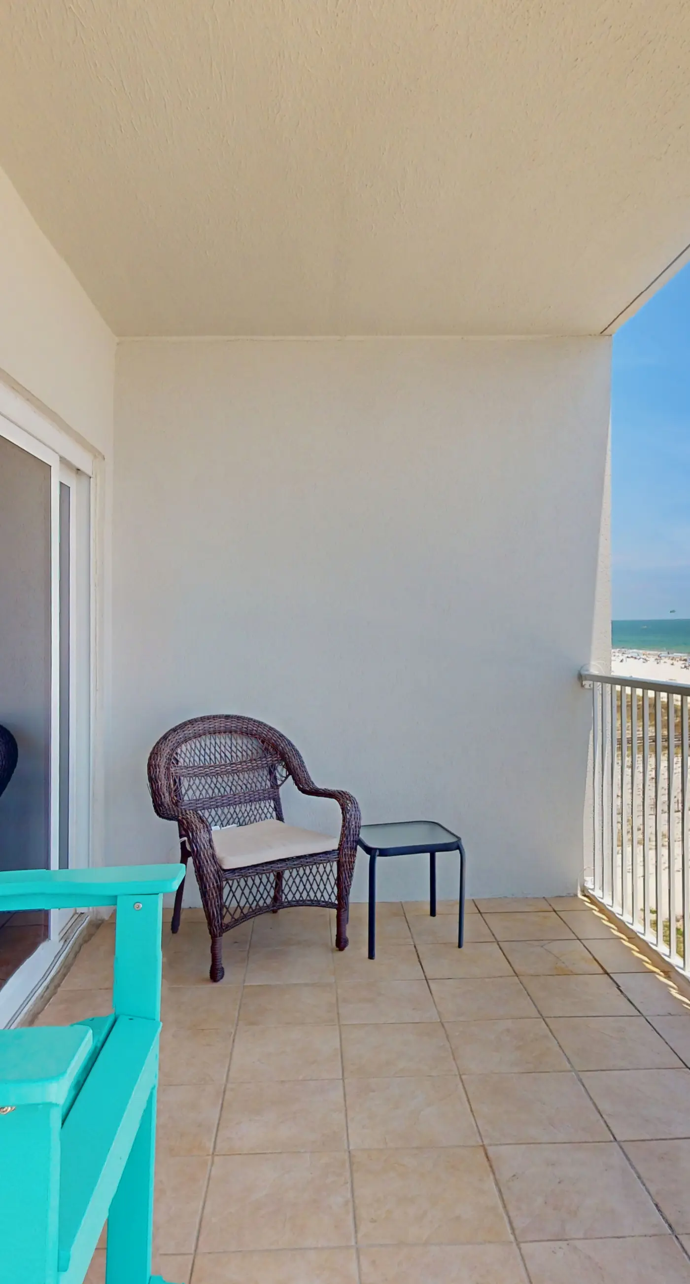 Beachfront, corner condo w a furnished balcony, shared pool, & grilling area