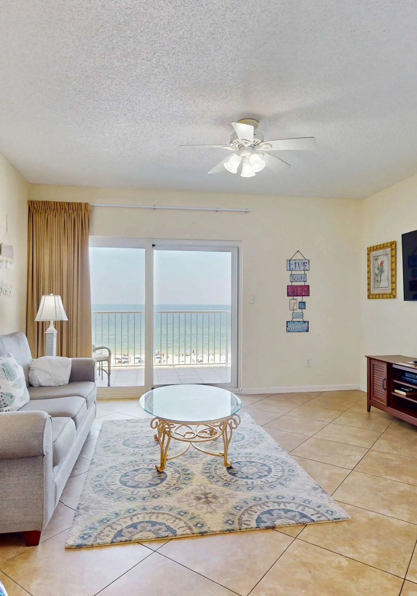 Beachfront, corner condo w a furnished balcony, shared pool, & grilling area