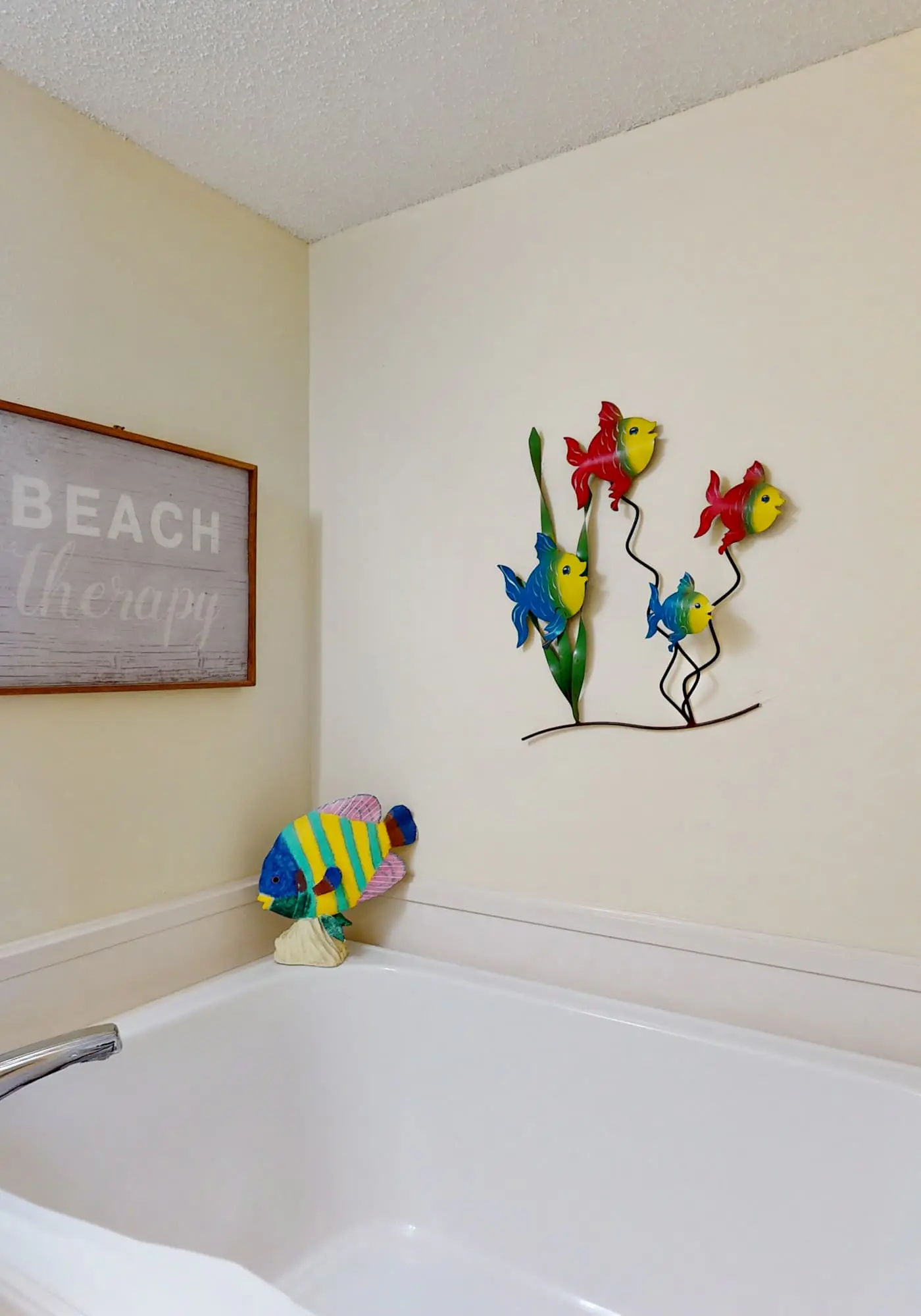 Beachfront, corner condo w a furnished balcony, shared pool, & grilling area