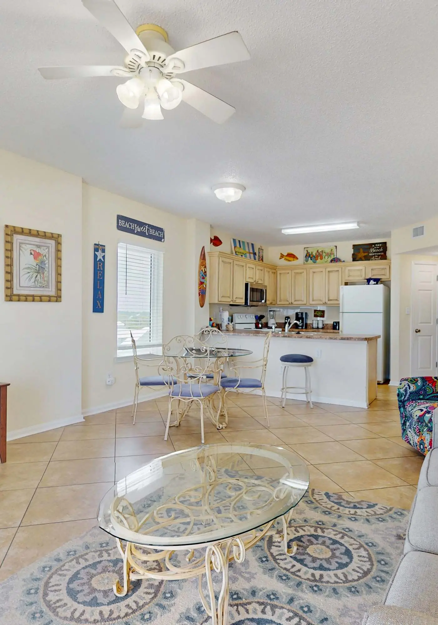 Beachfront, corner condo w a furnished balcony, shared pool, & grilling area