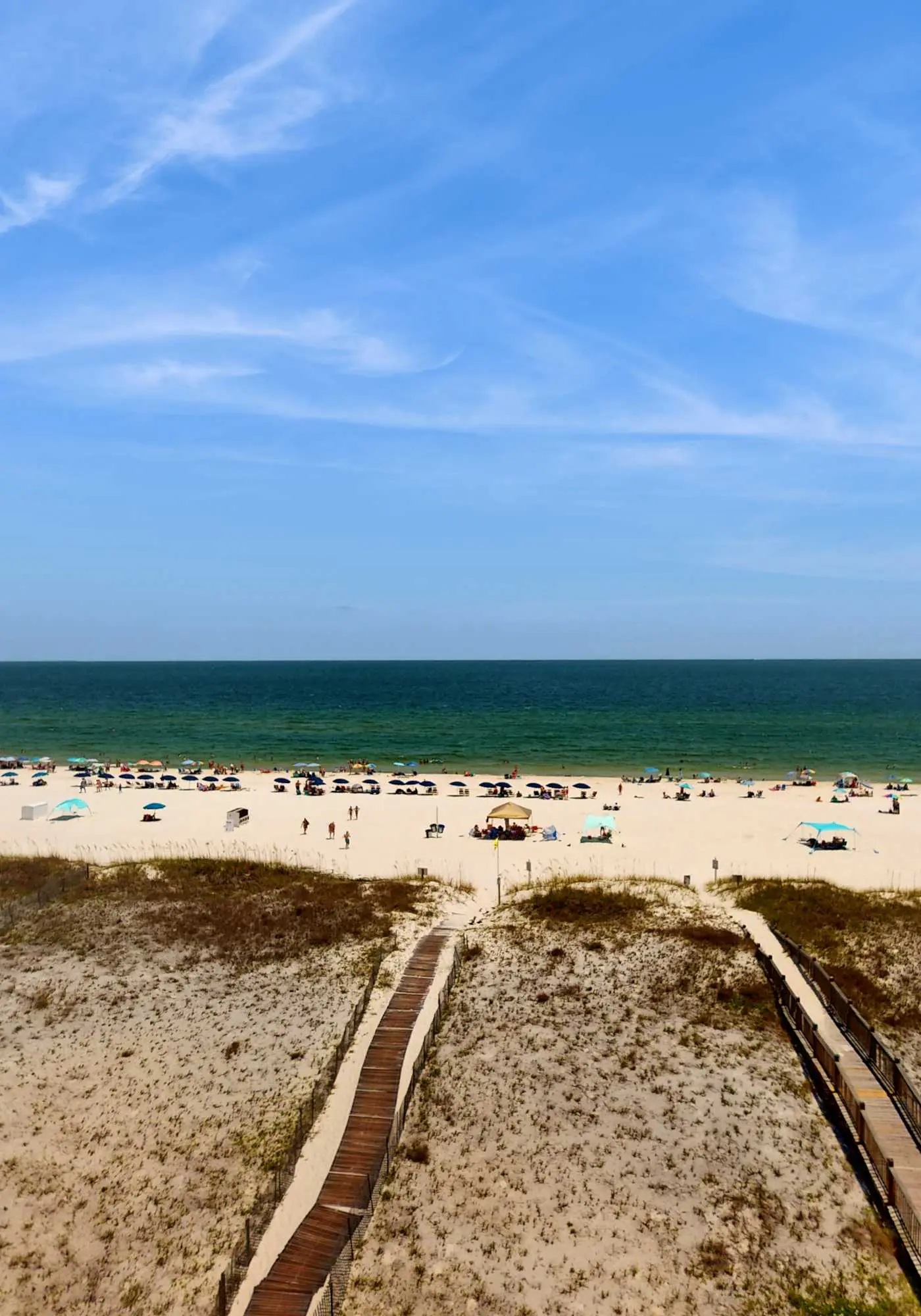 Beachfront, corner condo w a furnished balcony, shared pool, & grilling area