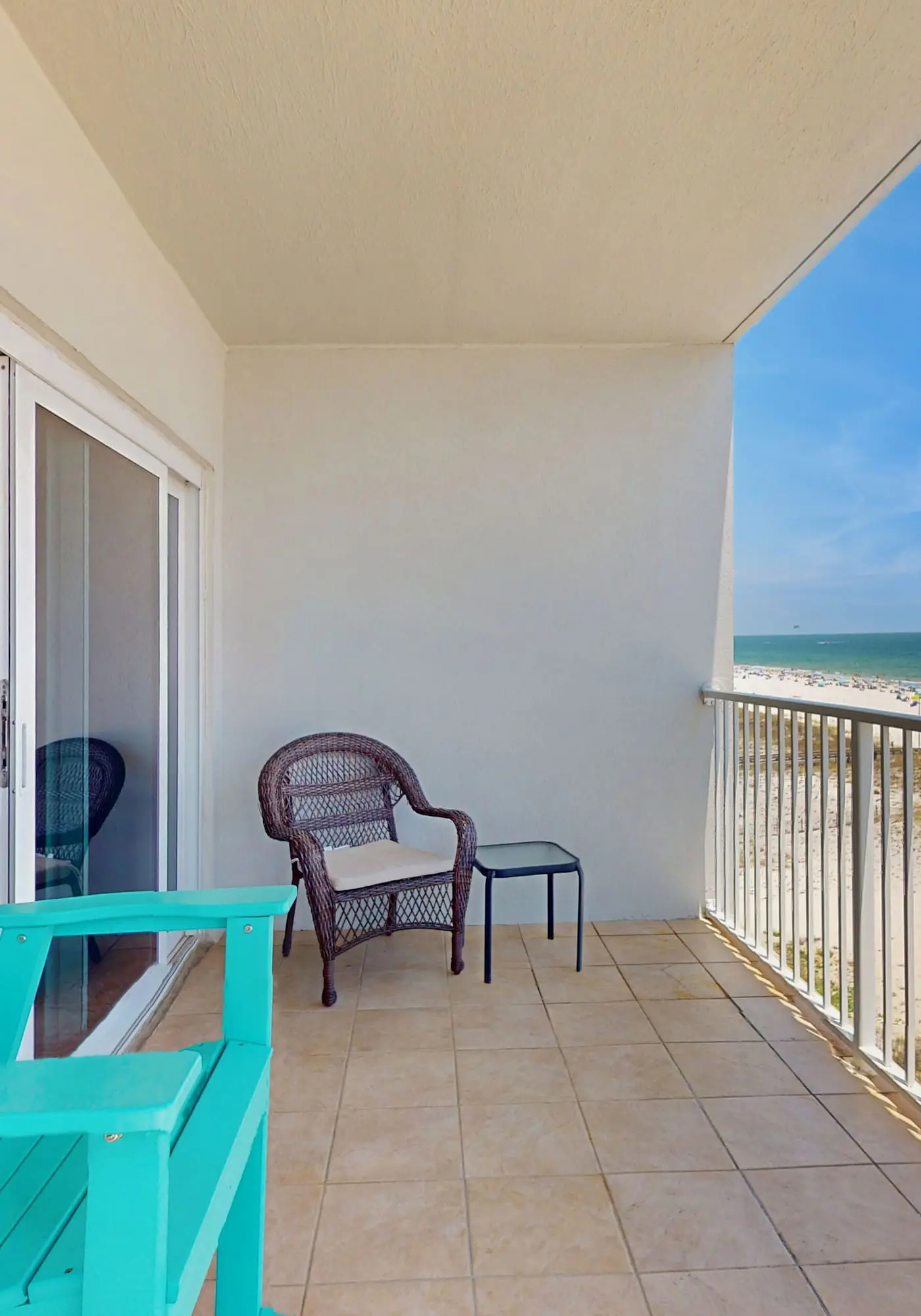 Beachfront, corner condo w a furnished balcony, shared pool, & grilling area