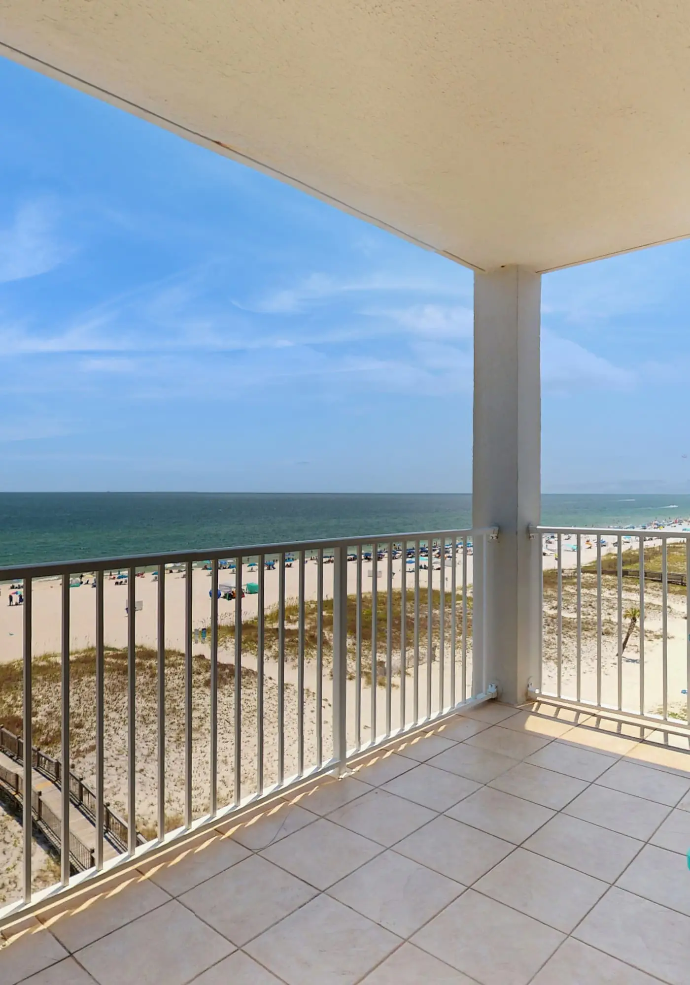 Beachfront, corner condo w a furnished balcony, shared pool, & grilling area