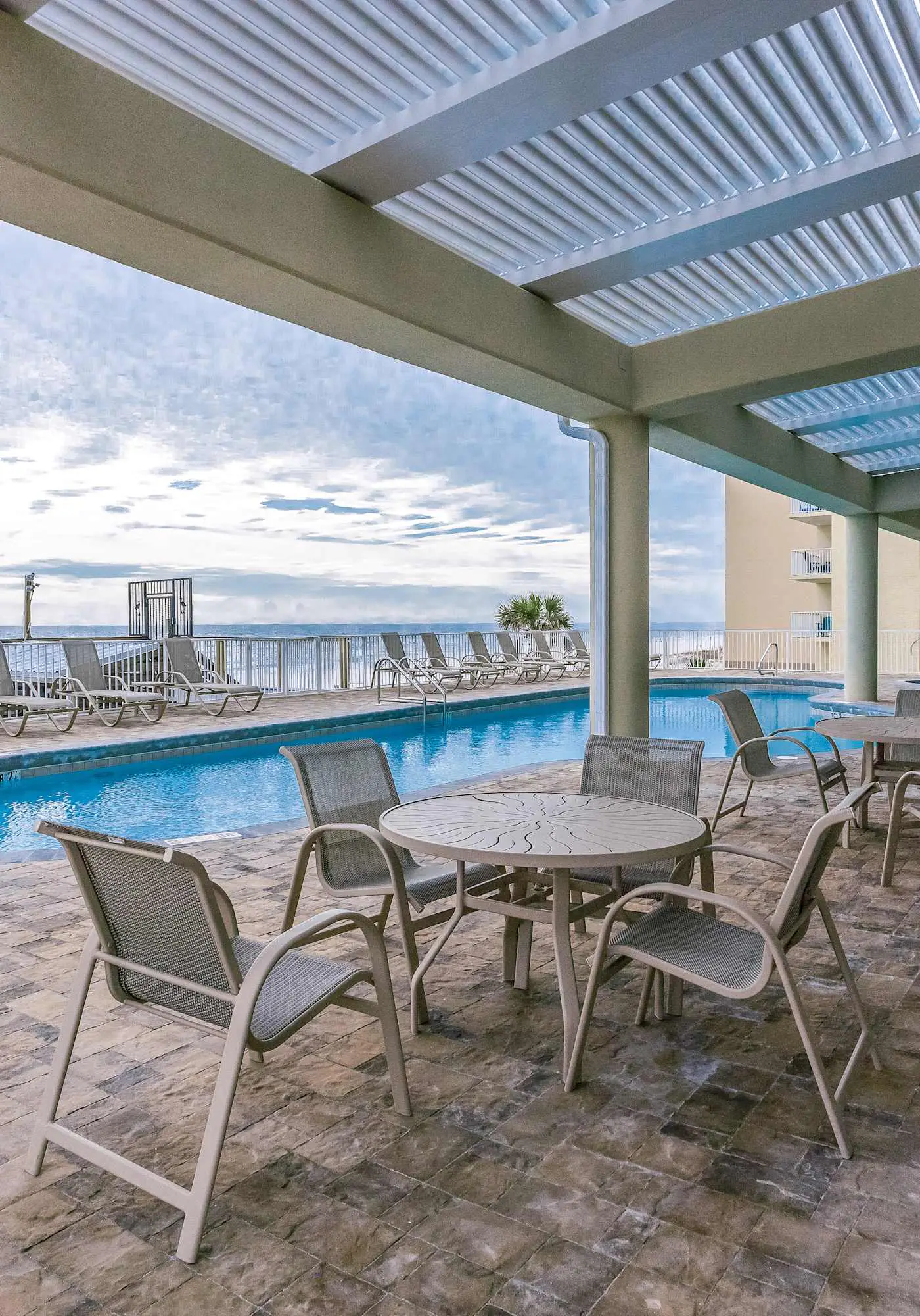 Gulf-front condo w private balcony & shared pool, hot tub, gym & sauna