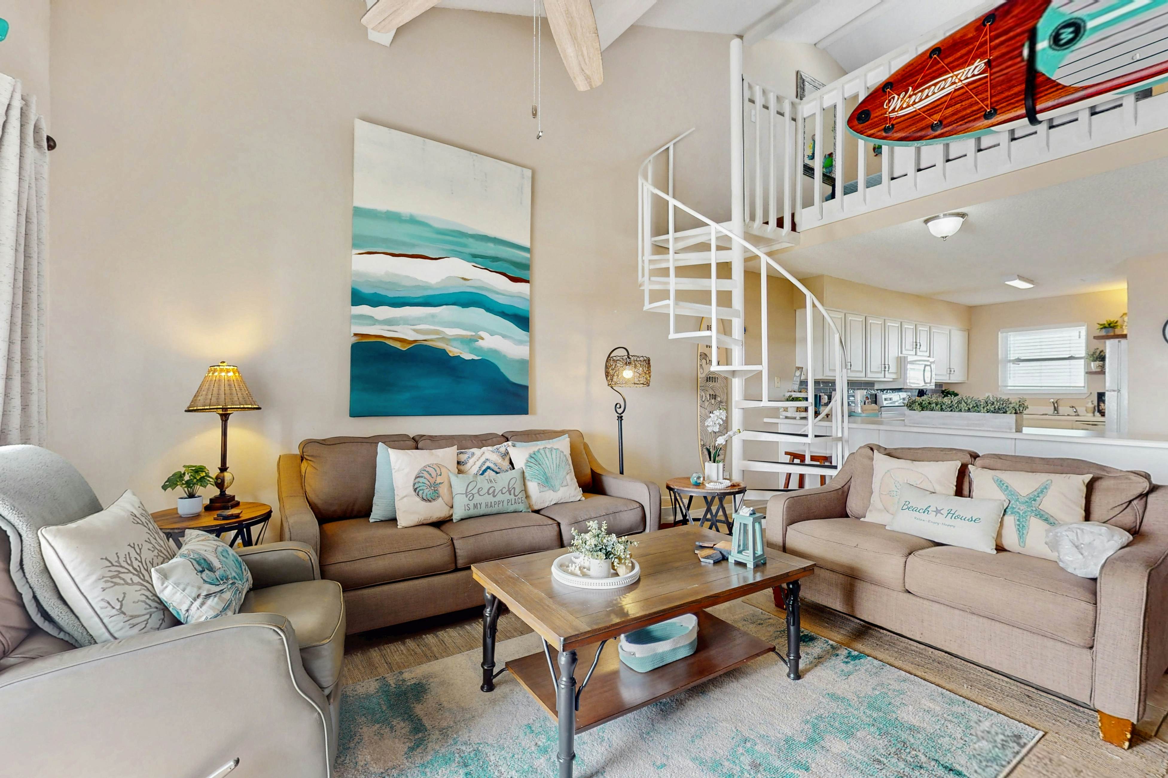 Waterfront condo with shared outdoor pool, furnished balcony, & beach access