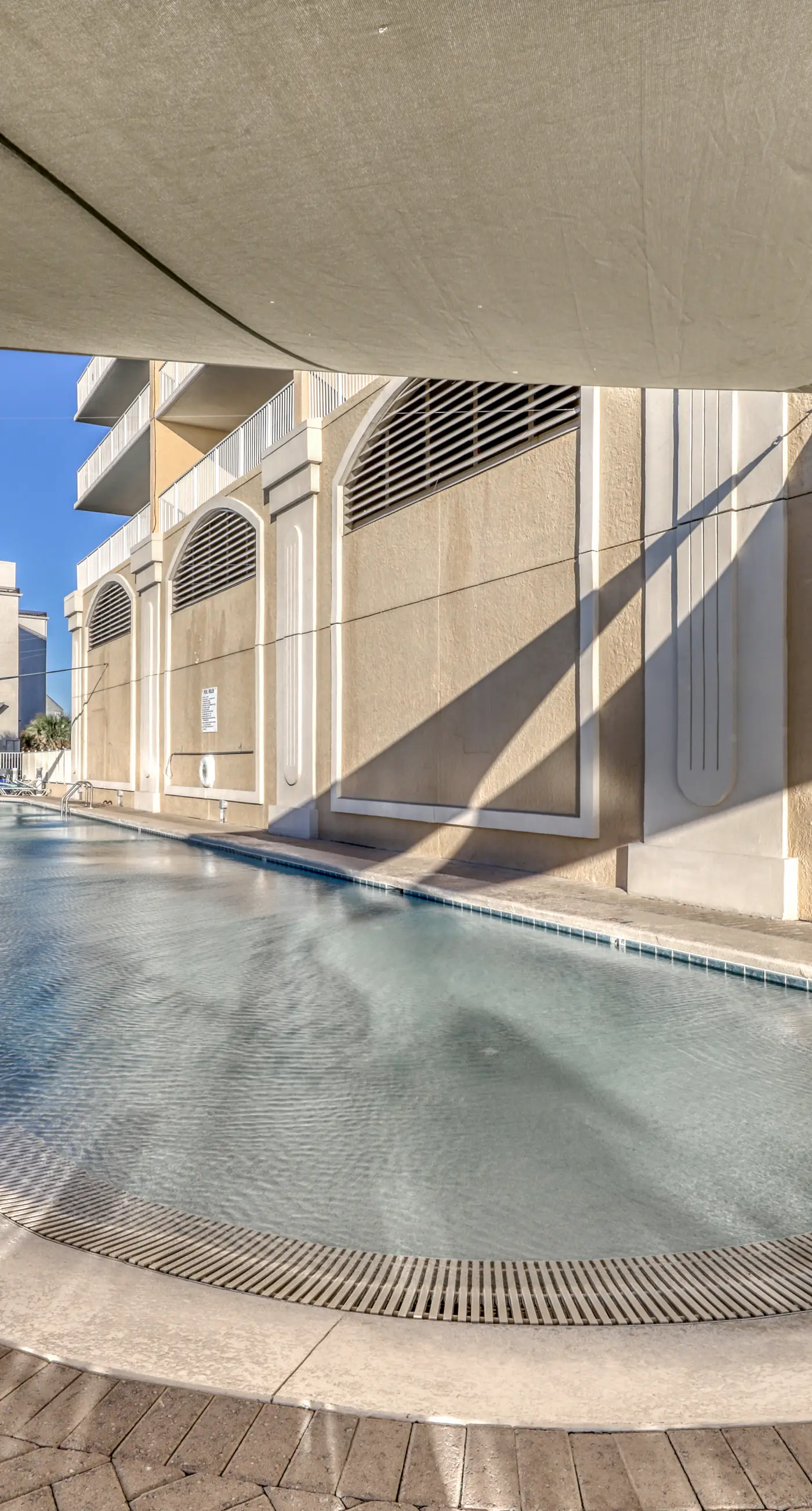 Gulf front condo with multiple community pools, a private balcony, & gym