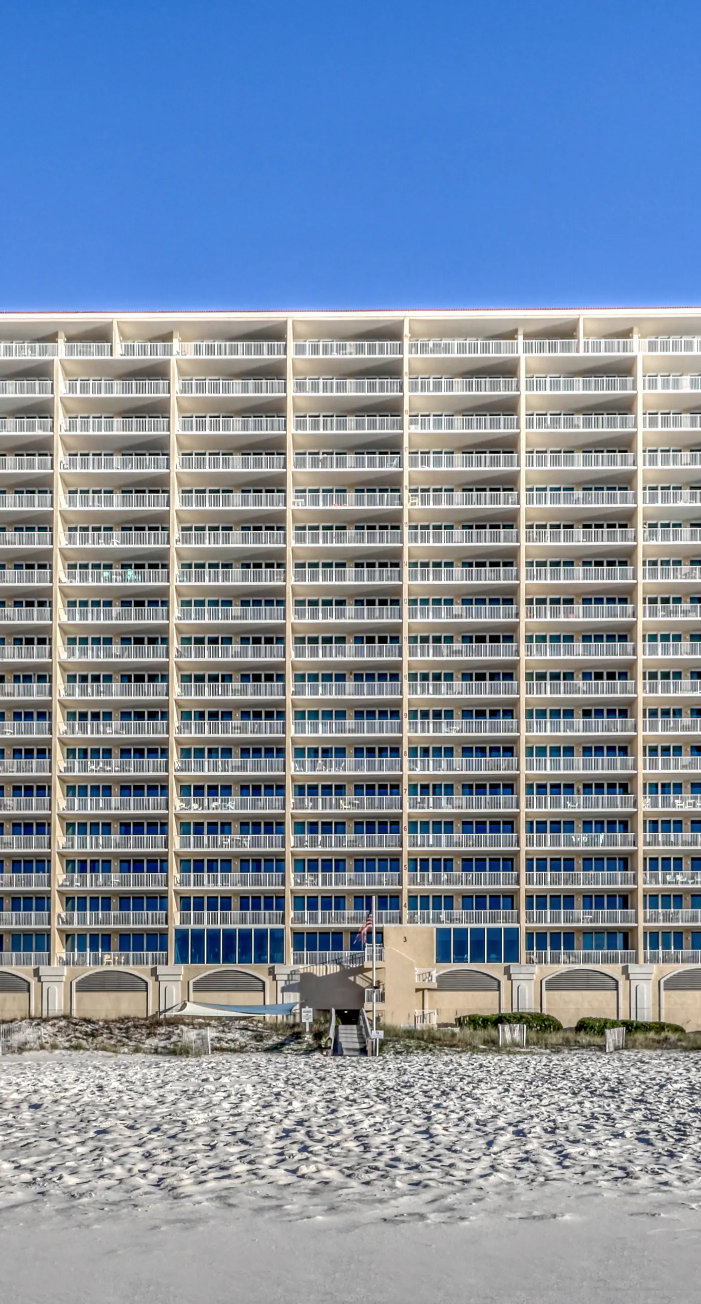 Gulf front condo with multiple community pools, a private balcony, & gym