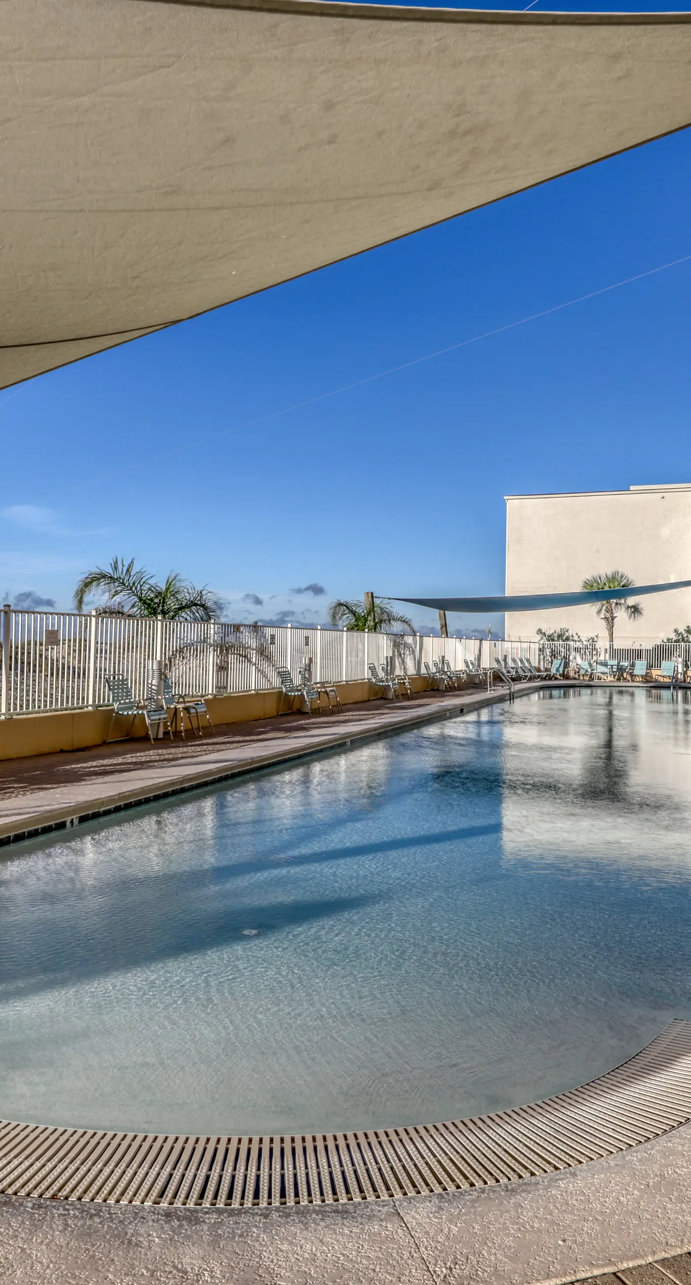 Gulf front condo with multiple community pools, a private balcony, & gym