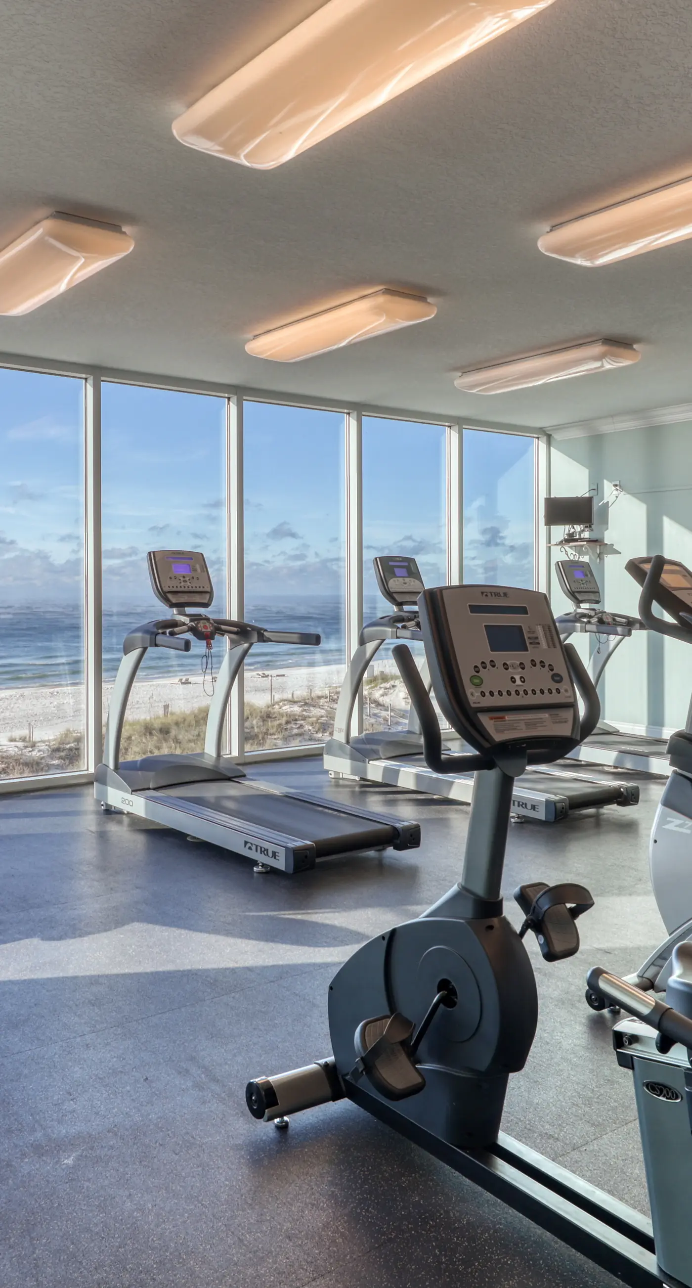 Gulf front condo with multiple community pools, a private balcony, & gym