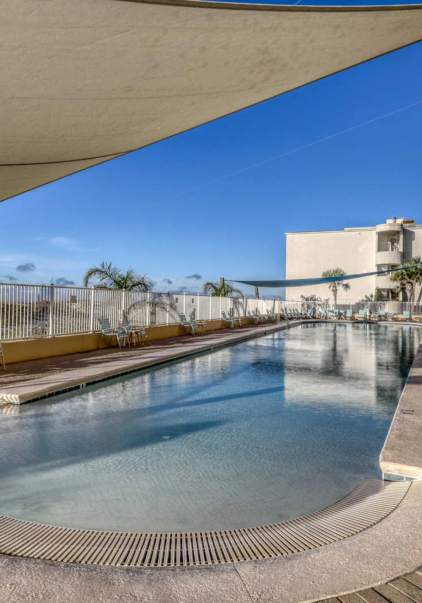 Gulf front condo with multiple community pools, a private balcony, & gym