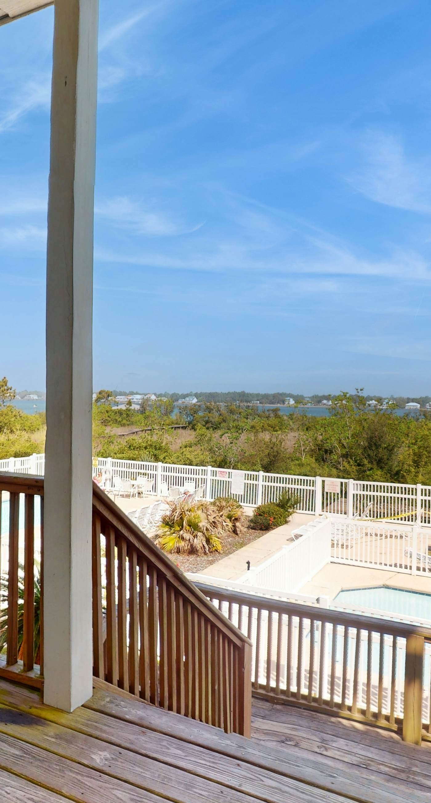 Lagoon-front dog-friendly duplex with heated outdoor pool, hot tub, & central AC