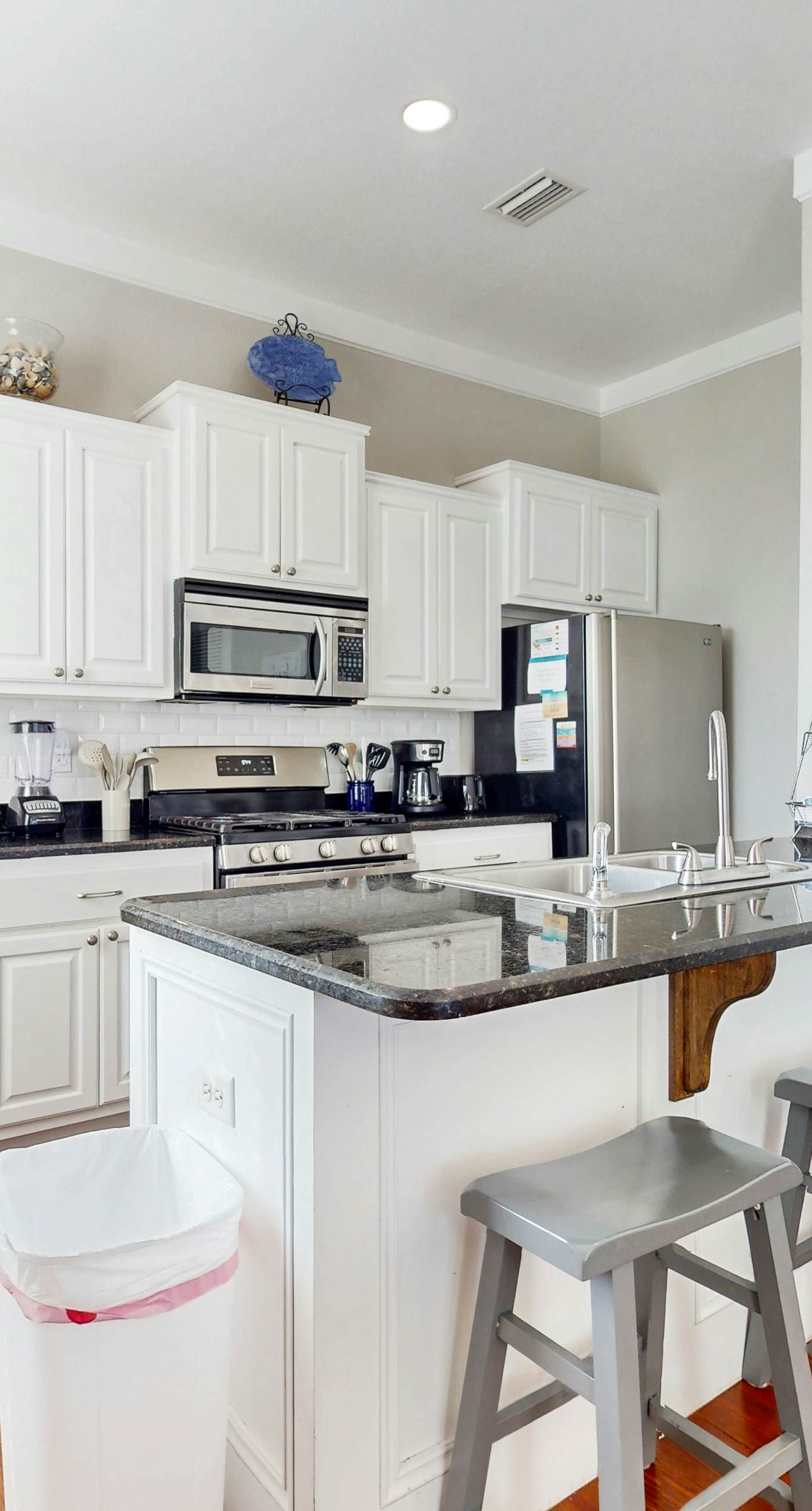 Lagoon-front dog-friendly duplex with heated outdoor pool, hot tub, & central AC