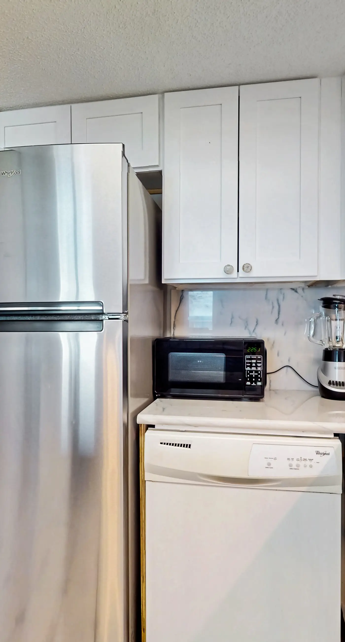 Gulf-front 3rd-floor condo with outdoor pool, central AC, & balcony