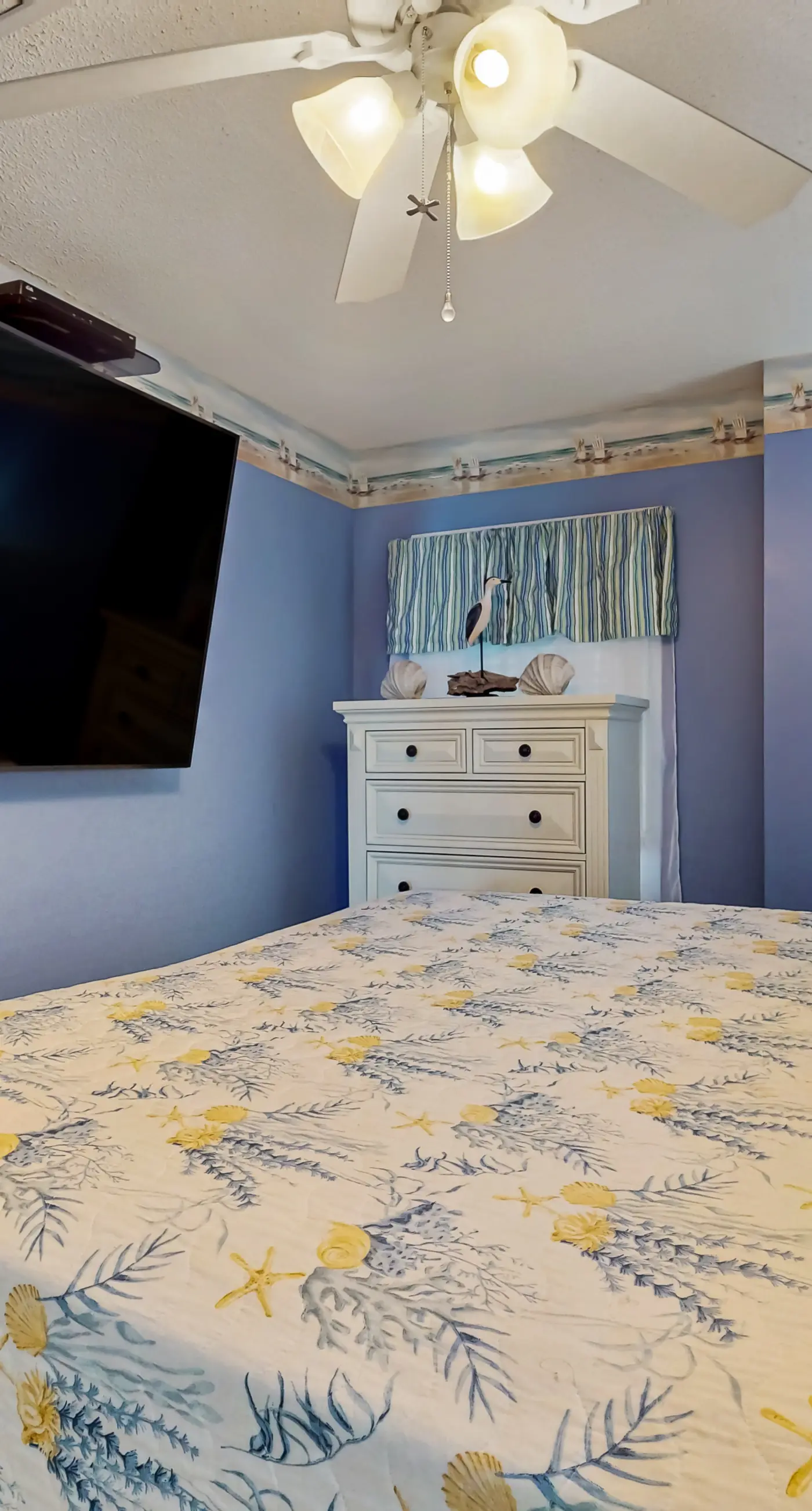 Gulf-front 3rd-floor condo with outdoor pool, central AC, & balcony