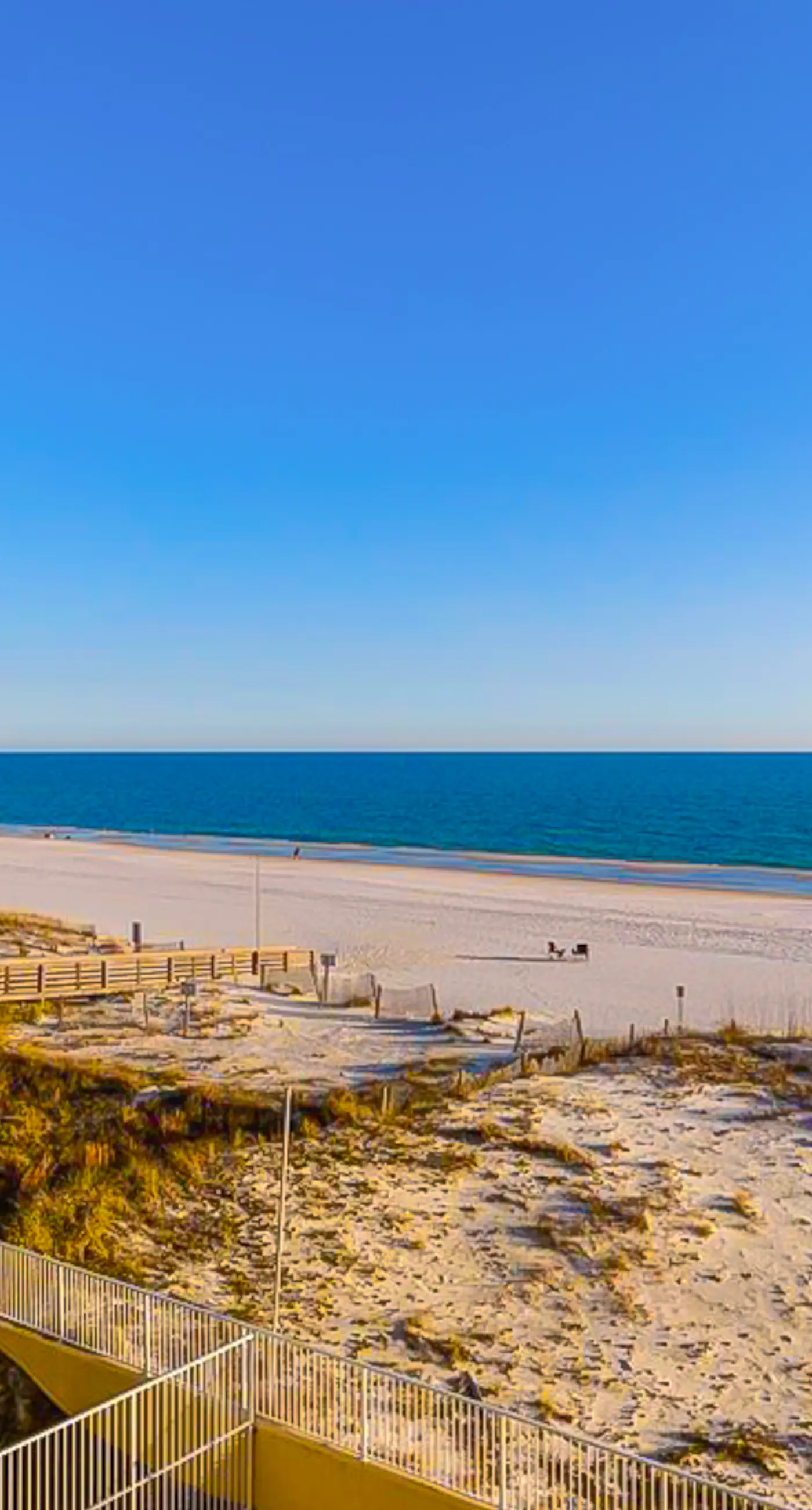 Gulf-front 3rd-floor condo with outdoor pool, central AC, & balcony