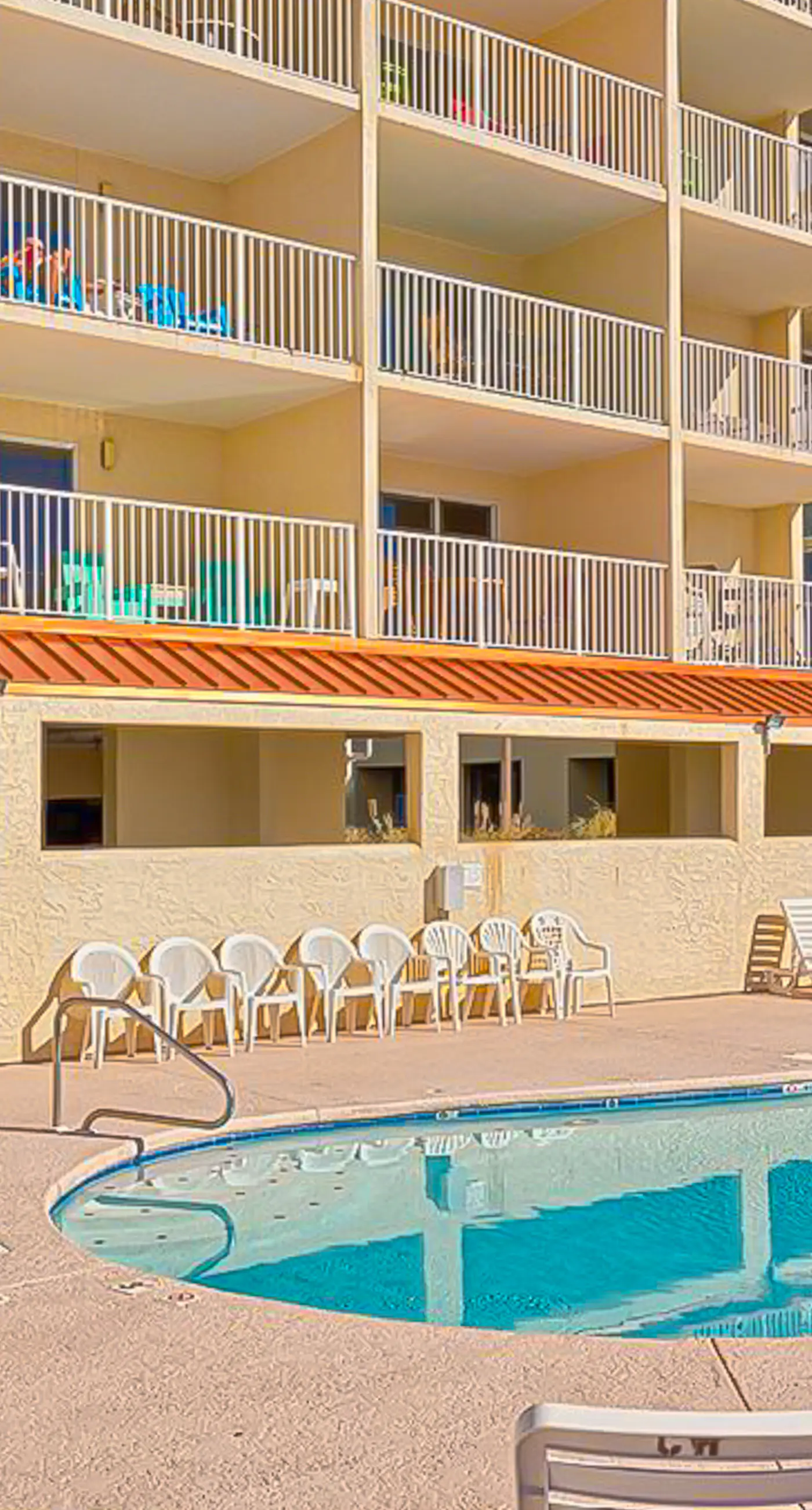 Gulf-front 3rd-floor condo with outdoor pool, central AC, & balcony