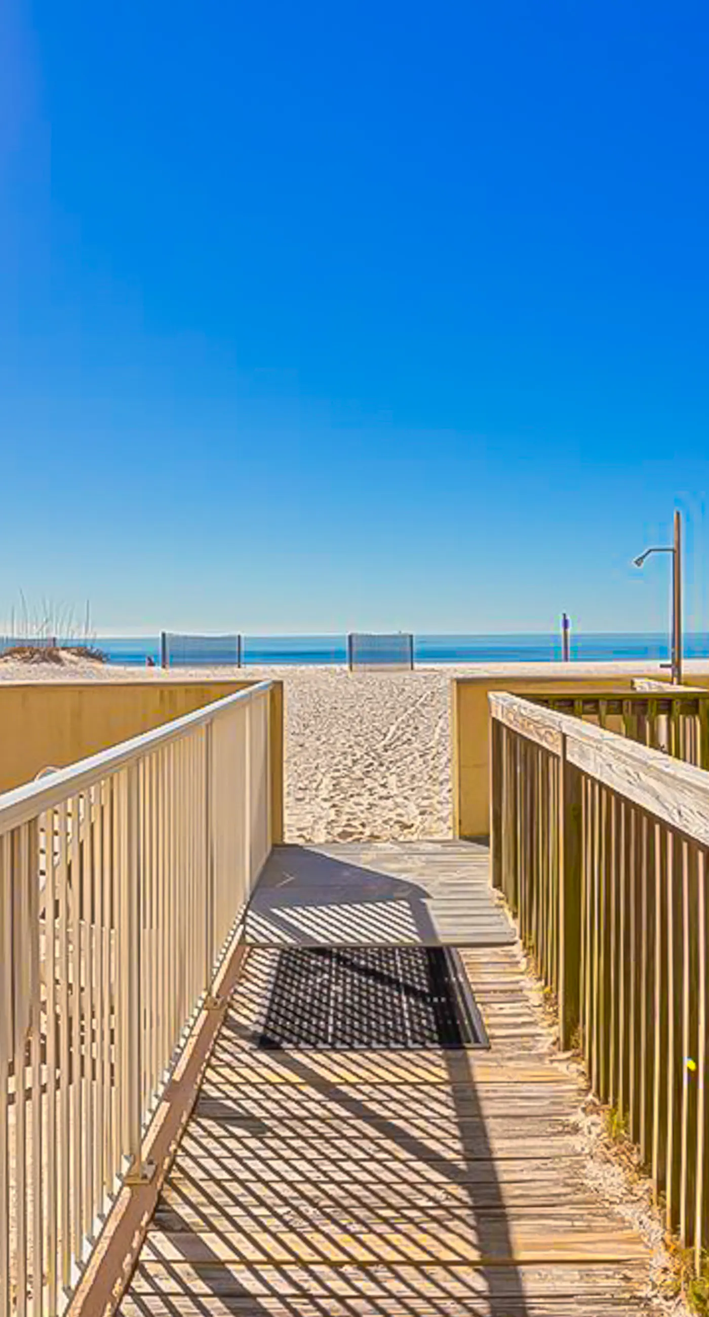 Gulf-front 3rd-floor condo with outdoor pool, central AC, & balcony