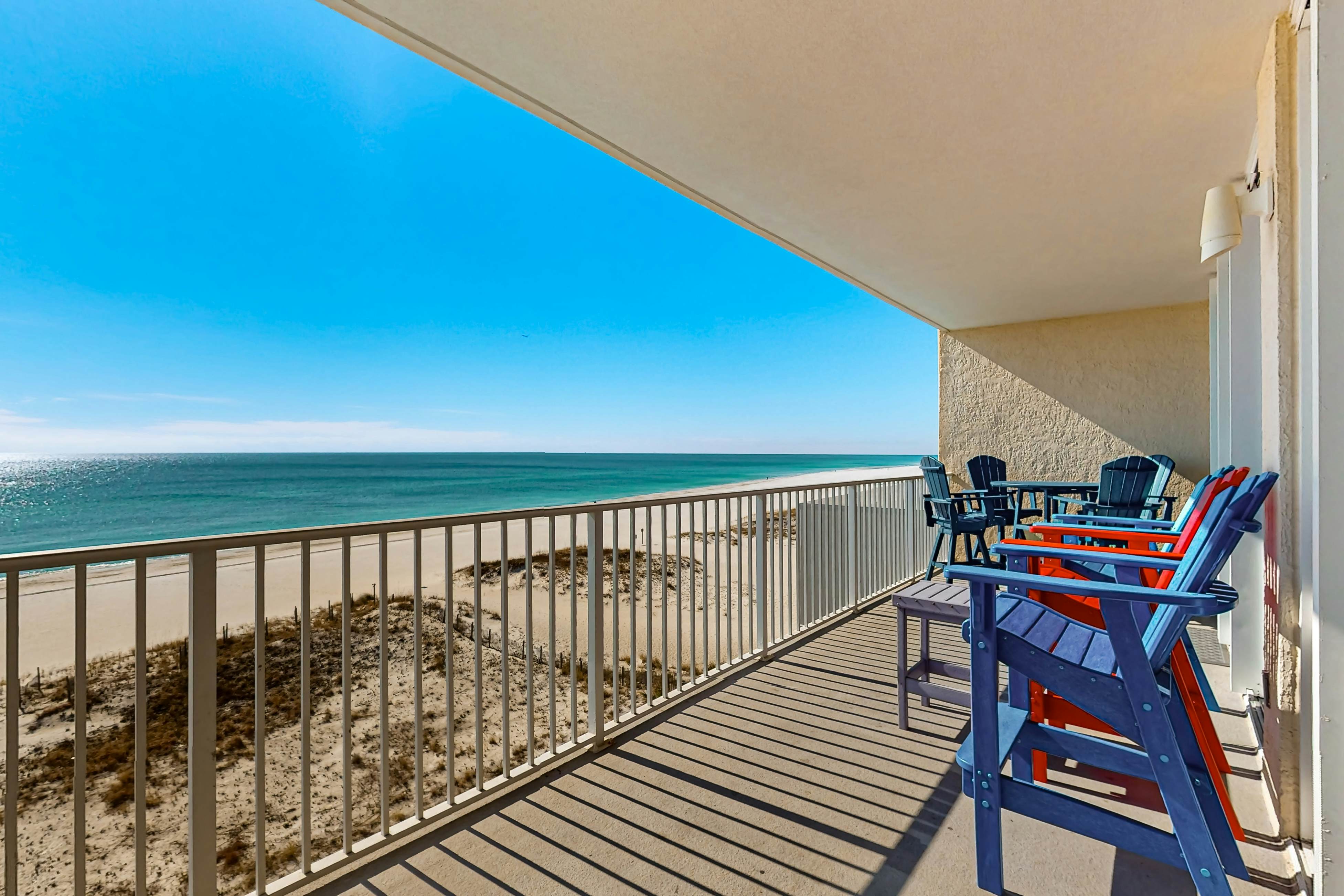 Colorful beachfront condo with Gulf views, pool, sauna, gym & W/D
