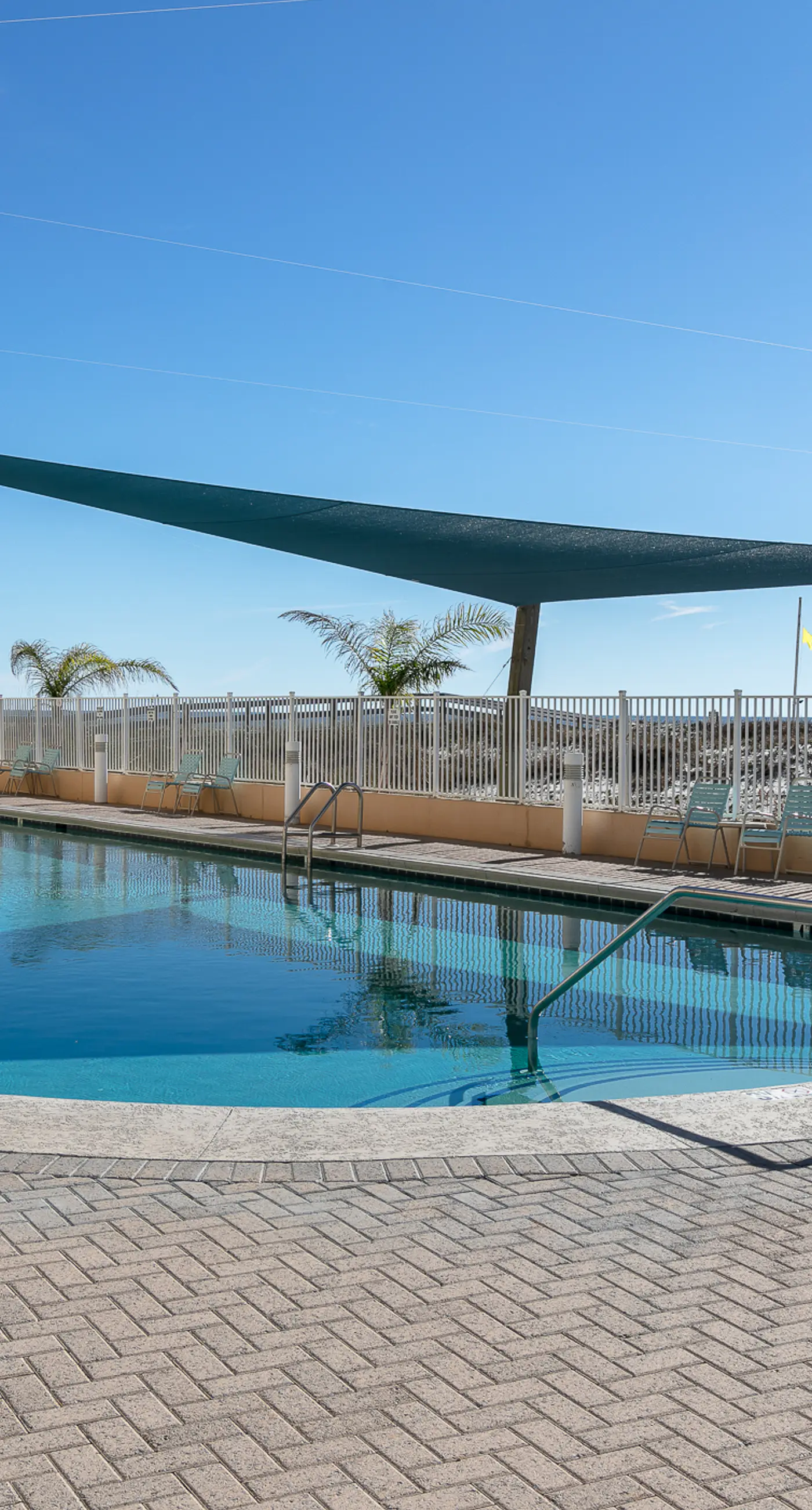 Colorful beachfront condo with Gulf views, pool, sauna, gym & W/D