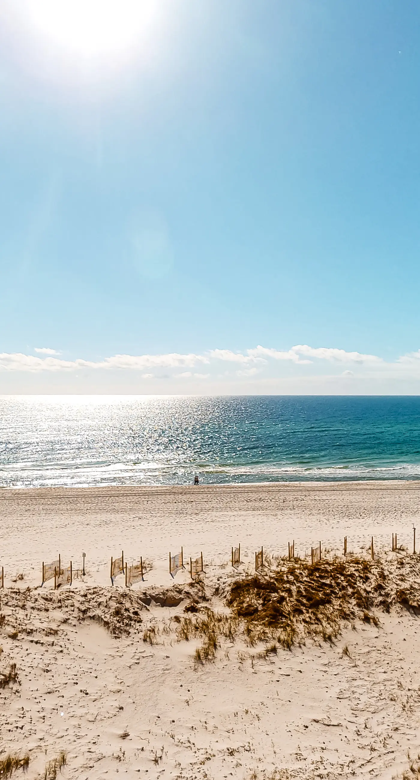 Colorful beachfront condo with Gulf views, pool, sauna, gym & W/D