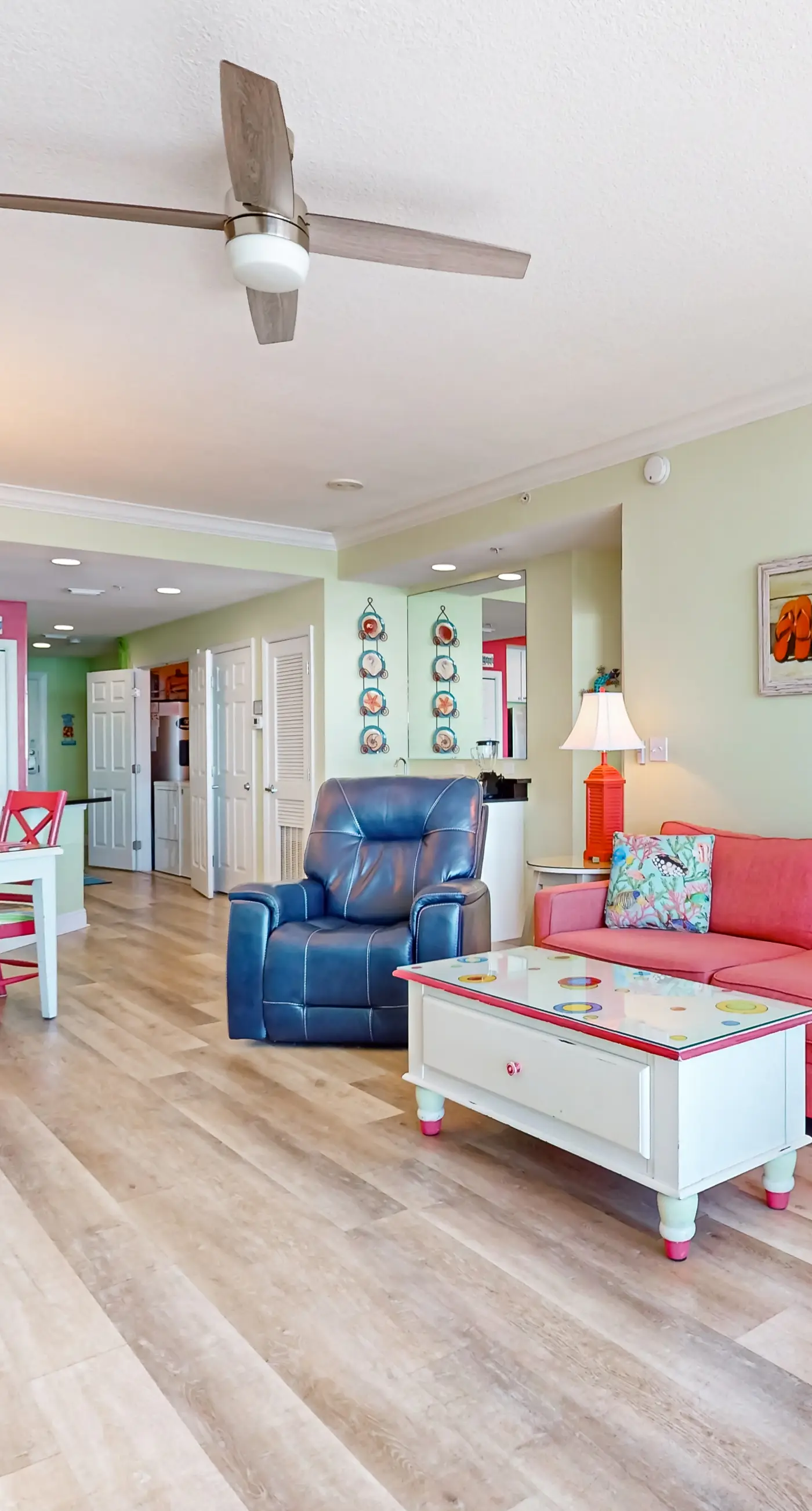 Colorful beachfront condo with Gulf views, pool, sauna, gym & W/D