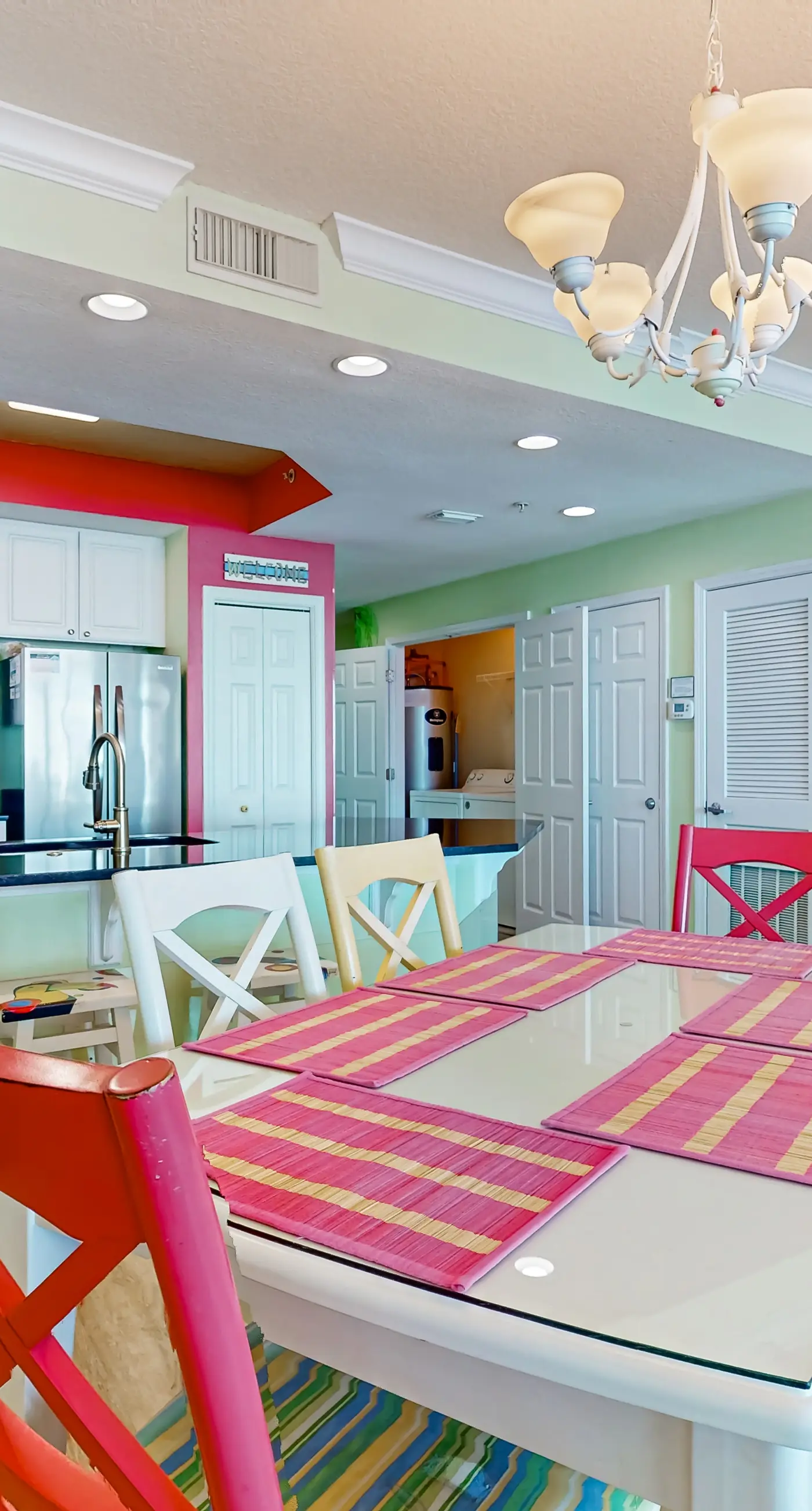 Colorful beachfront condo with Gulf views, pool, sauna, gym & W/D