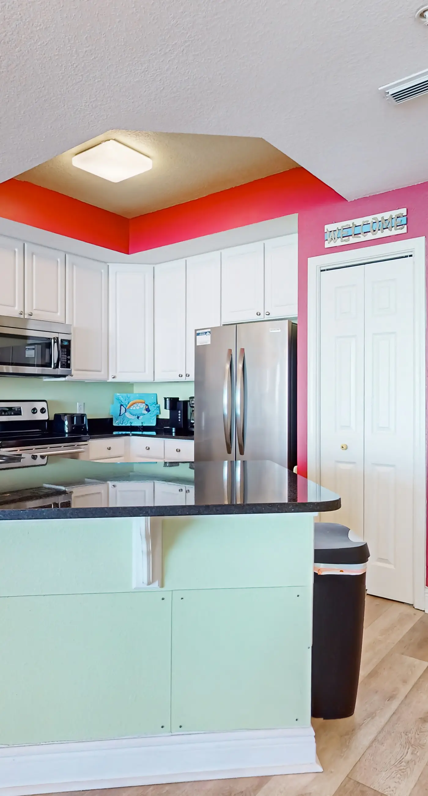 Colorful beachfront condo with Gulf views, pool, sauna, gym & W/D