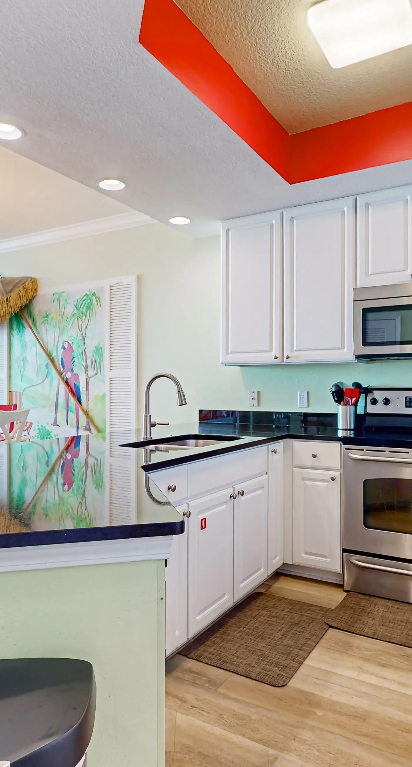 Colorful beachfront condo with Gulf views, pool, sauna, gym & W/D