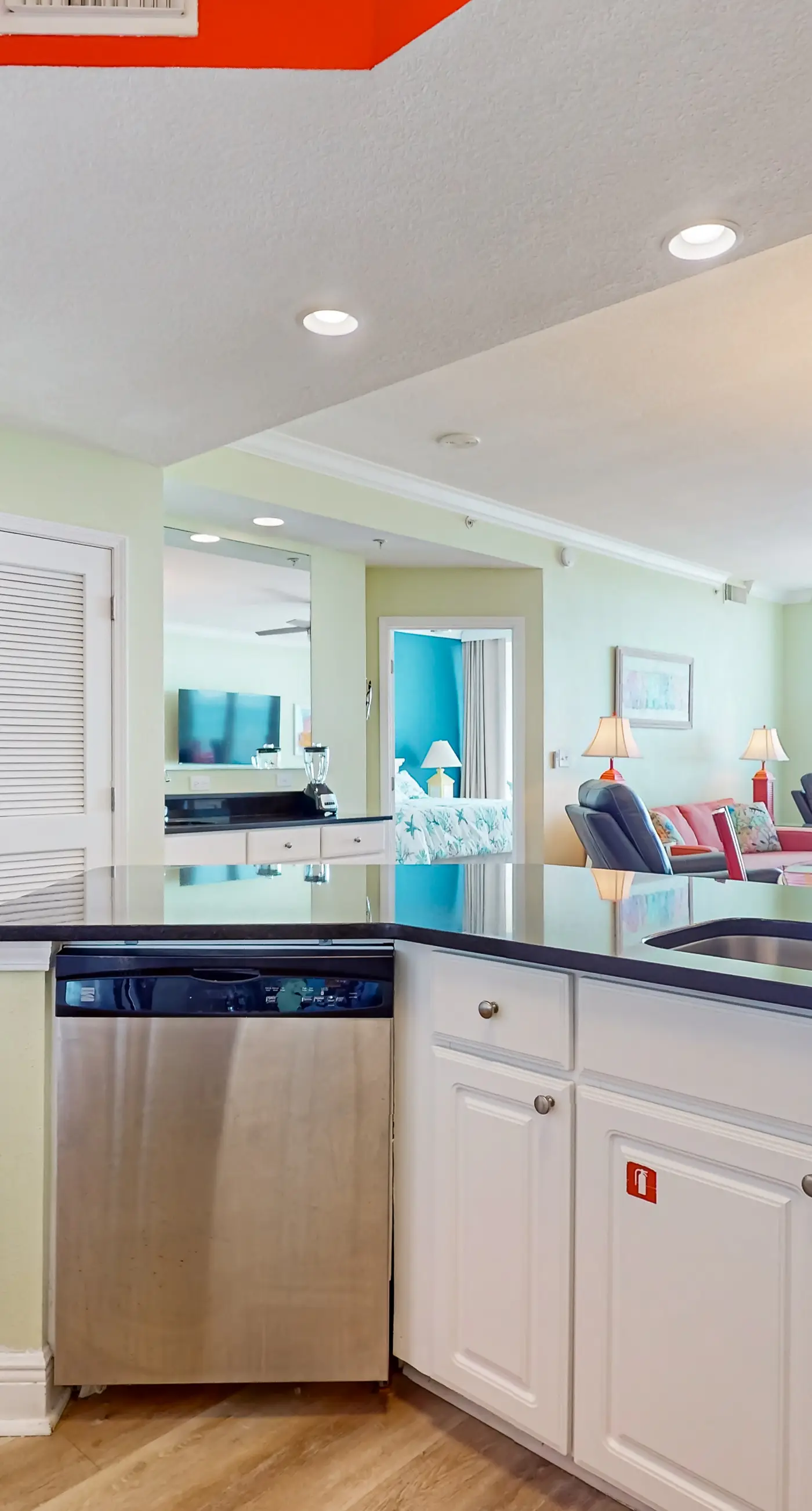 Colorful beachfront condo with Gulf views, pool, sauna, gym & W/D