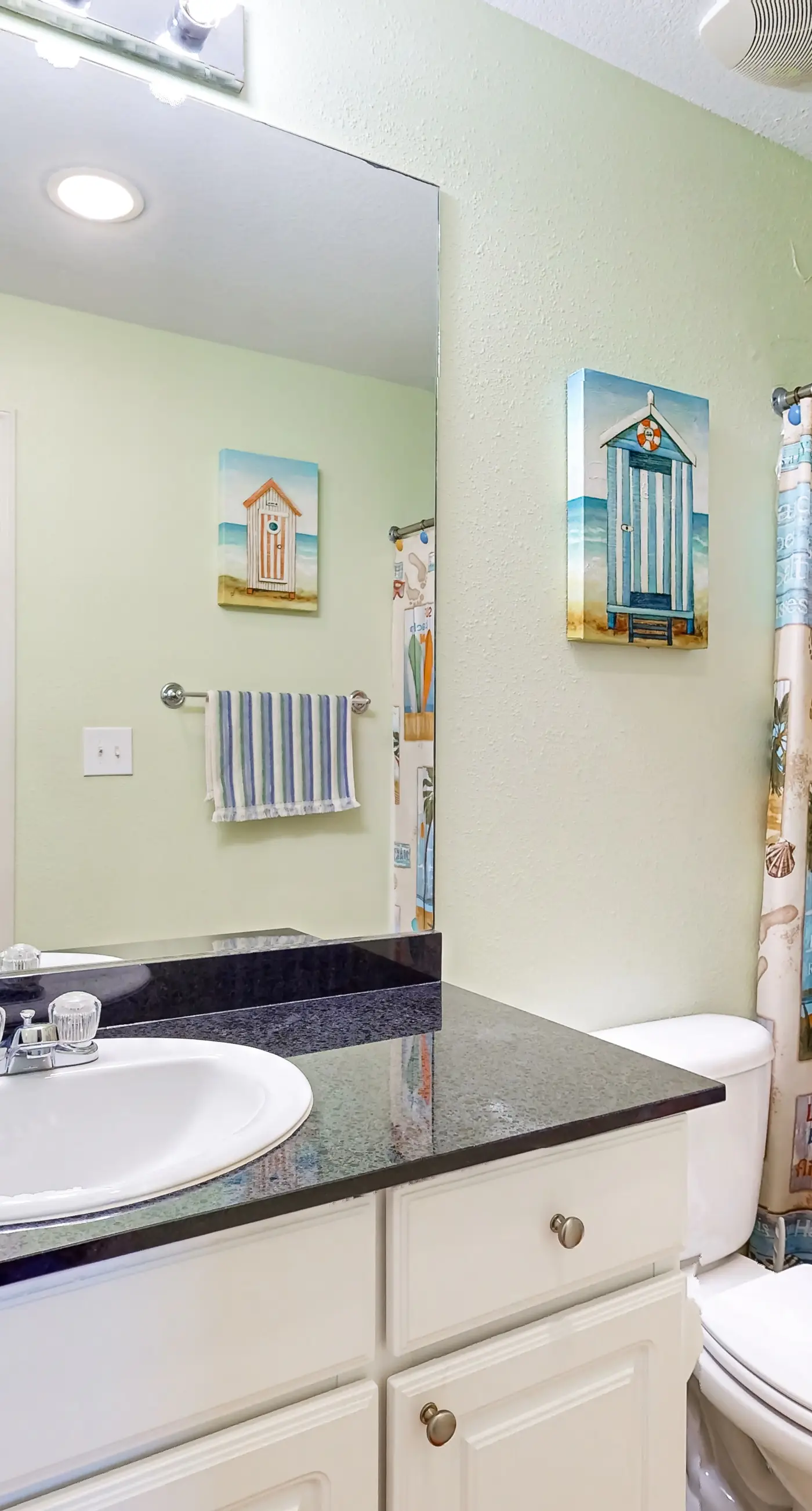 Colorful beachfront condo with Gulf views, pool, sauna, gym & W/D