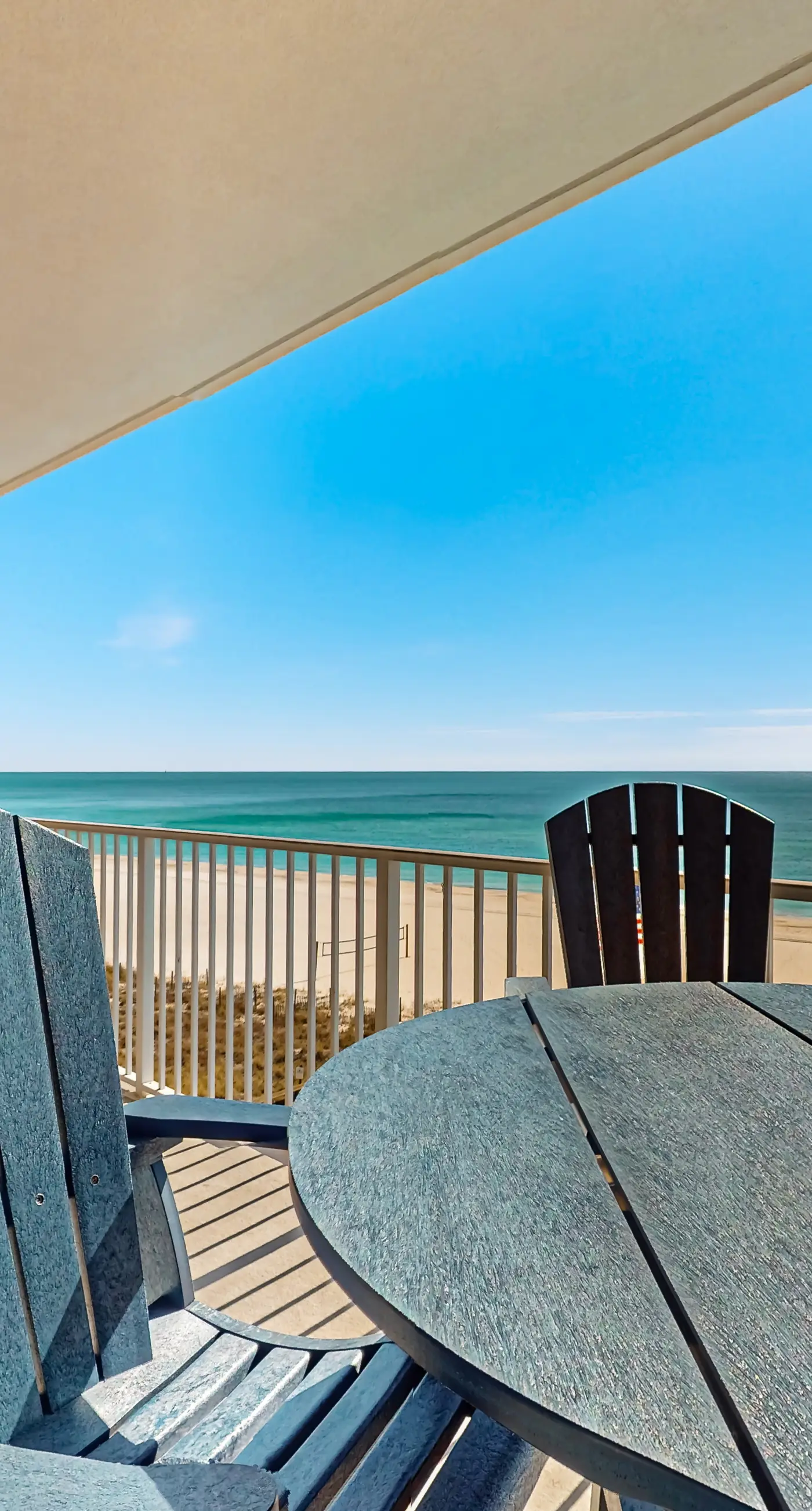 Colorful beachfront condo with Gulf views, pool, sauna, gym & W/D