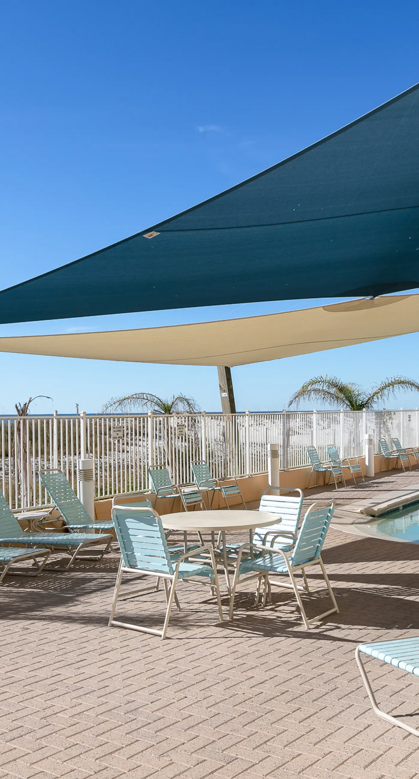 Colorful beachfront condo with Gulf views, pool, sauna, gym & W/D