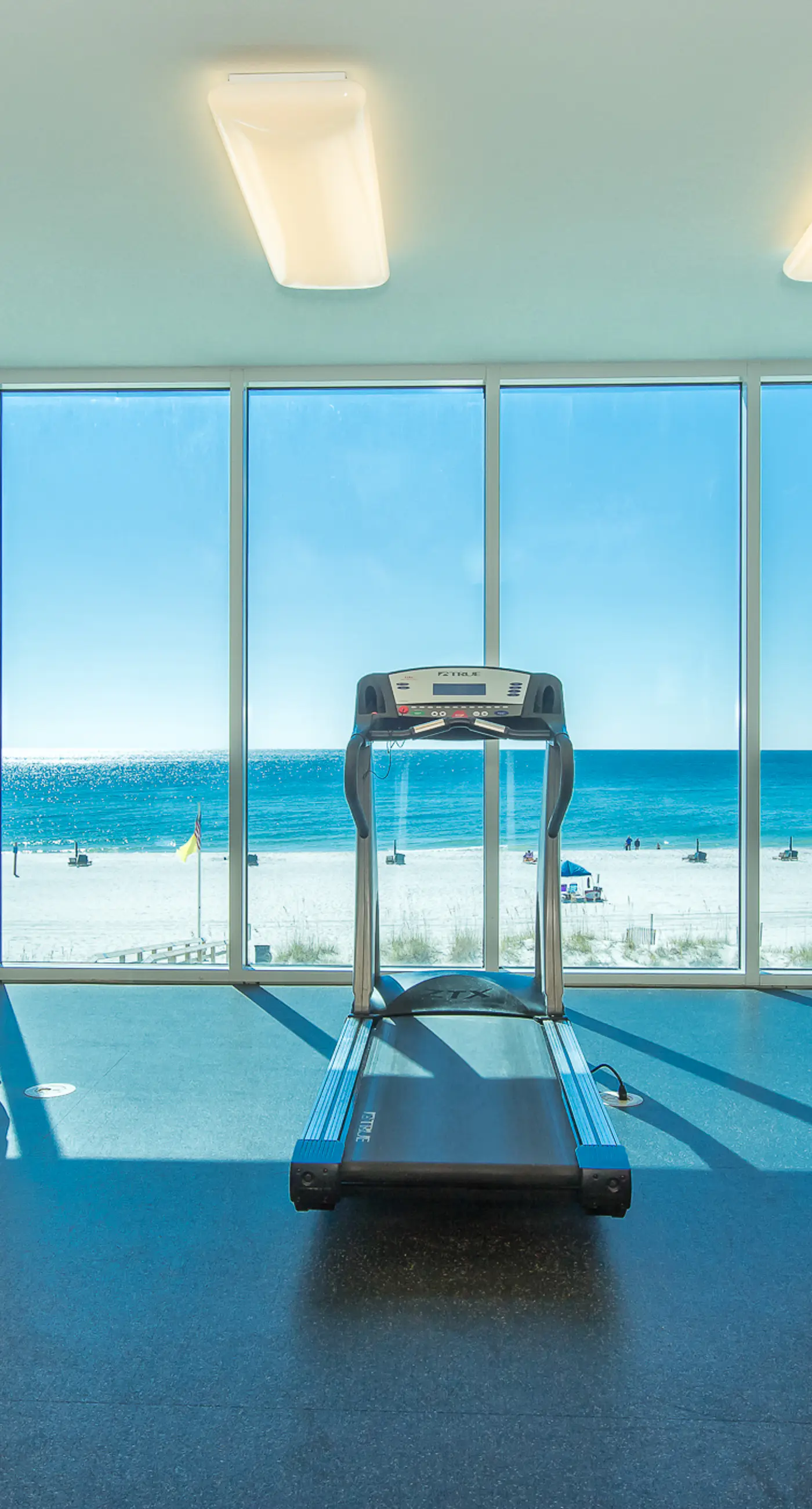 Colorful beachfront condo with Gulf views, pool, sauna, gym & W/D