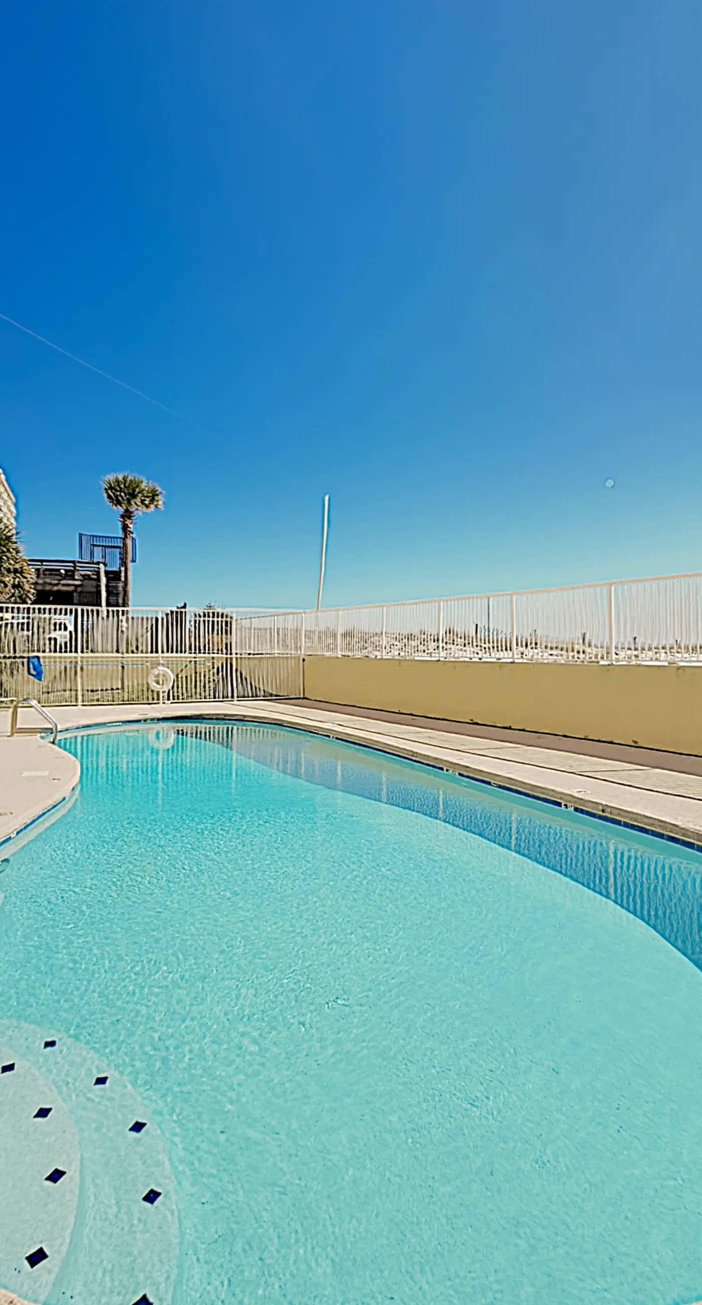 Clearwater condo with bunk room, pool, & balcony - walk to waves