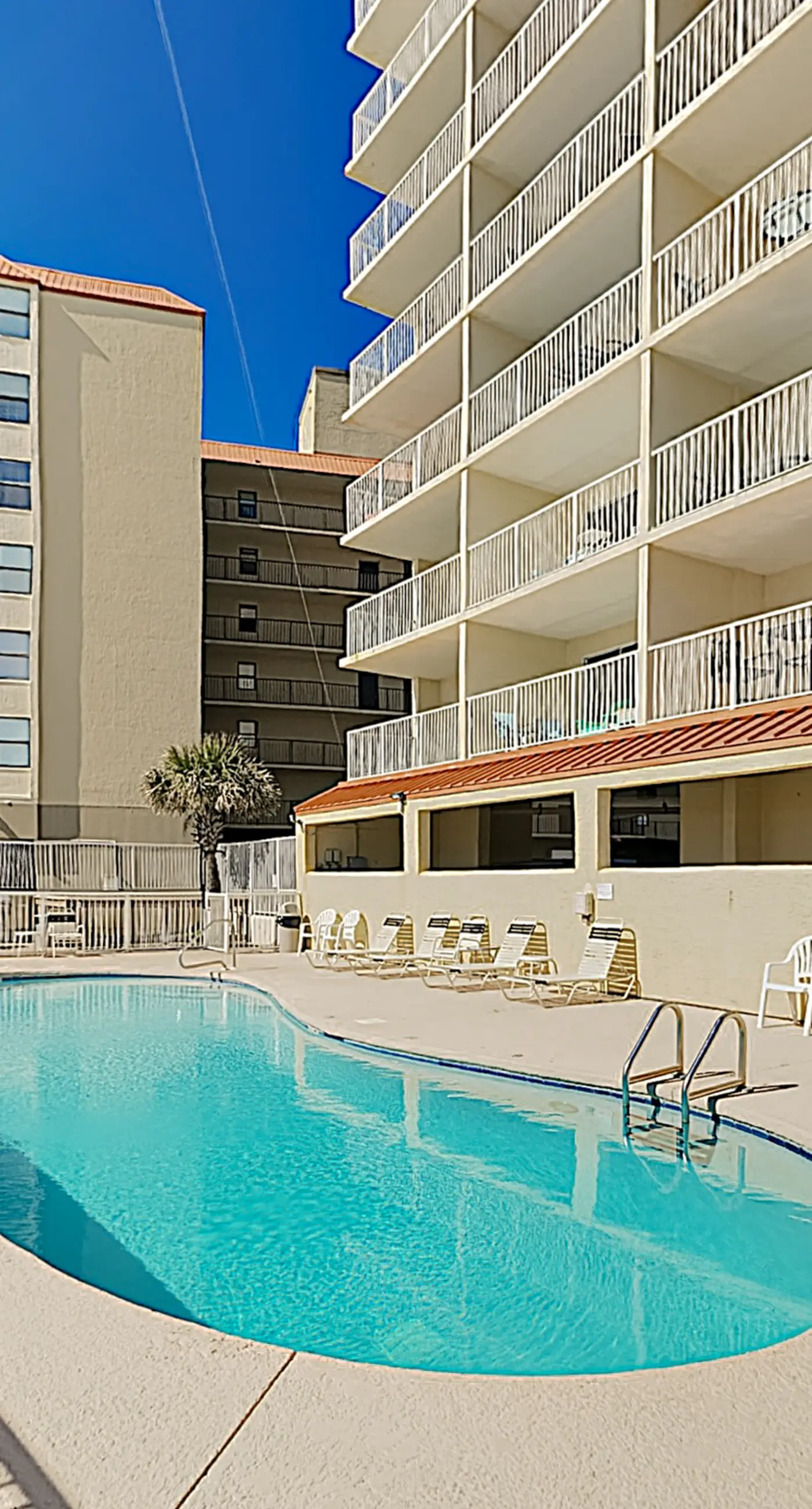 Clearwater condo with bunk room, pool, & balcony - walk to waves