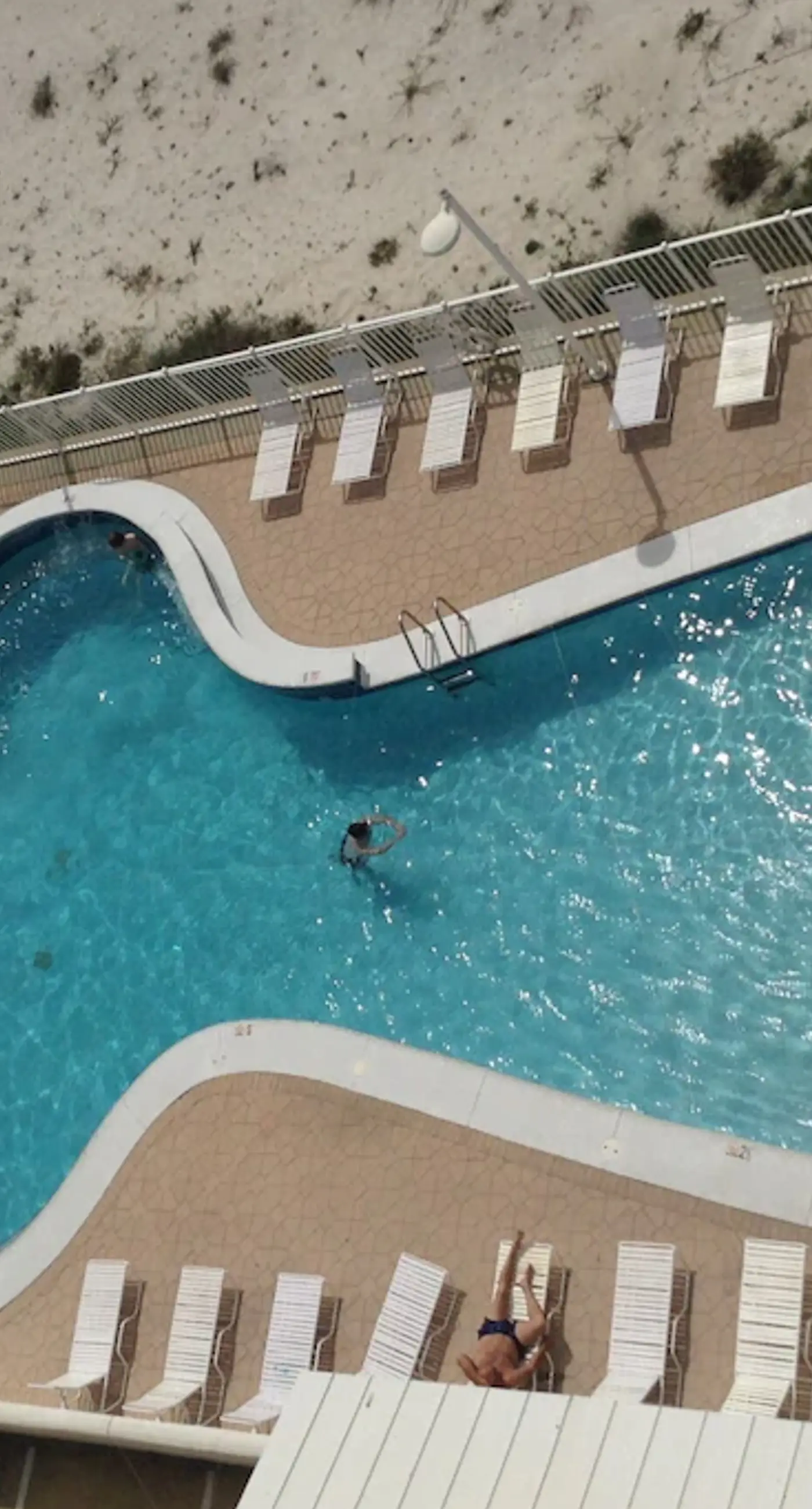 Gulf-front condo with furnished balcony, fast WiFi, pool & fitness room