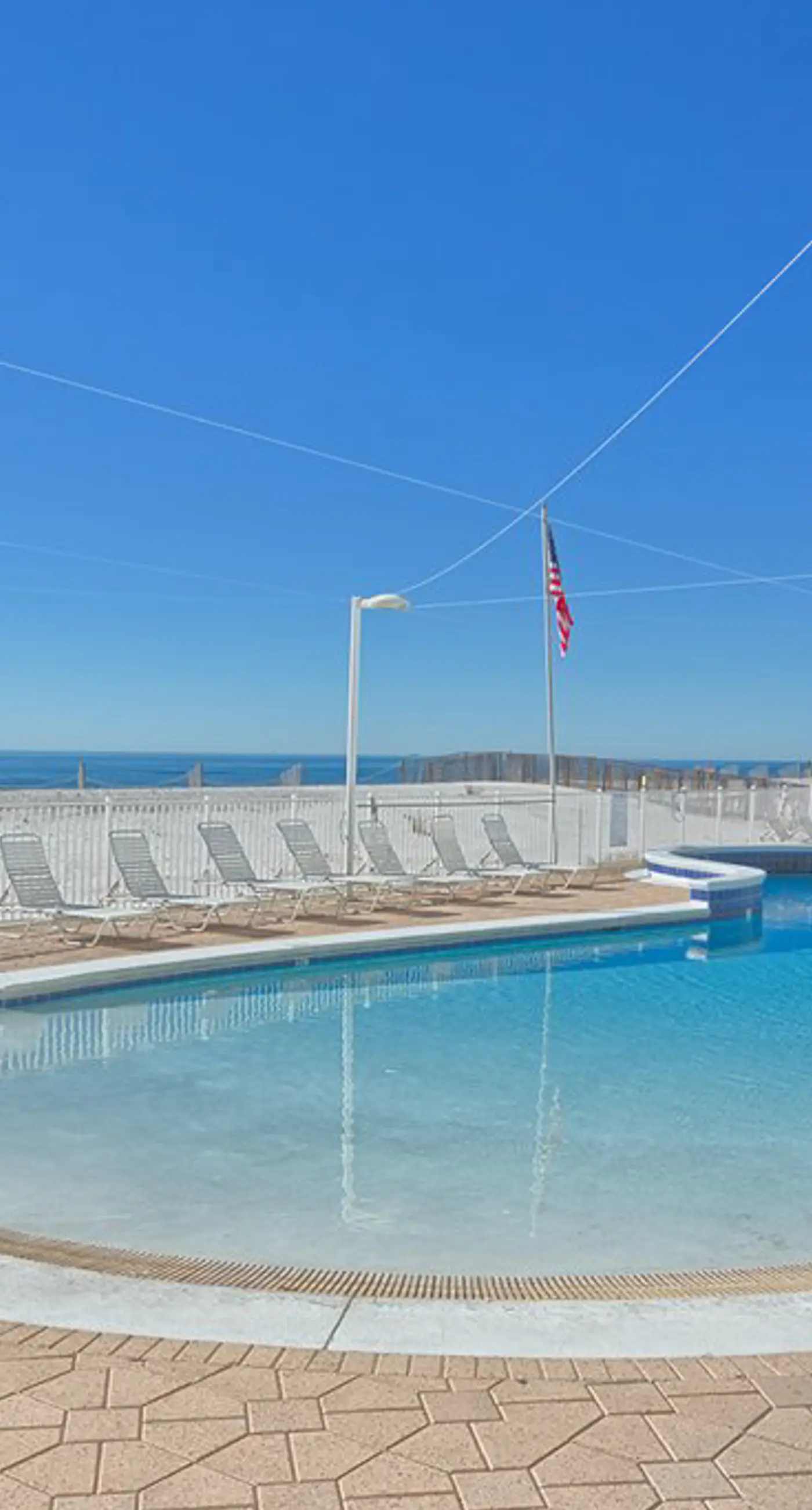 Gulf-front condo with furnished balcony, fast WiFi, pool & fitness room
