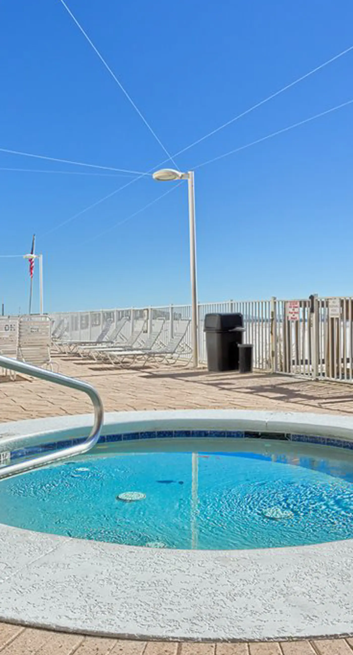 Gulf-front condo with furnished balcony, fast WiFi, pool & fitness room