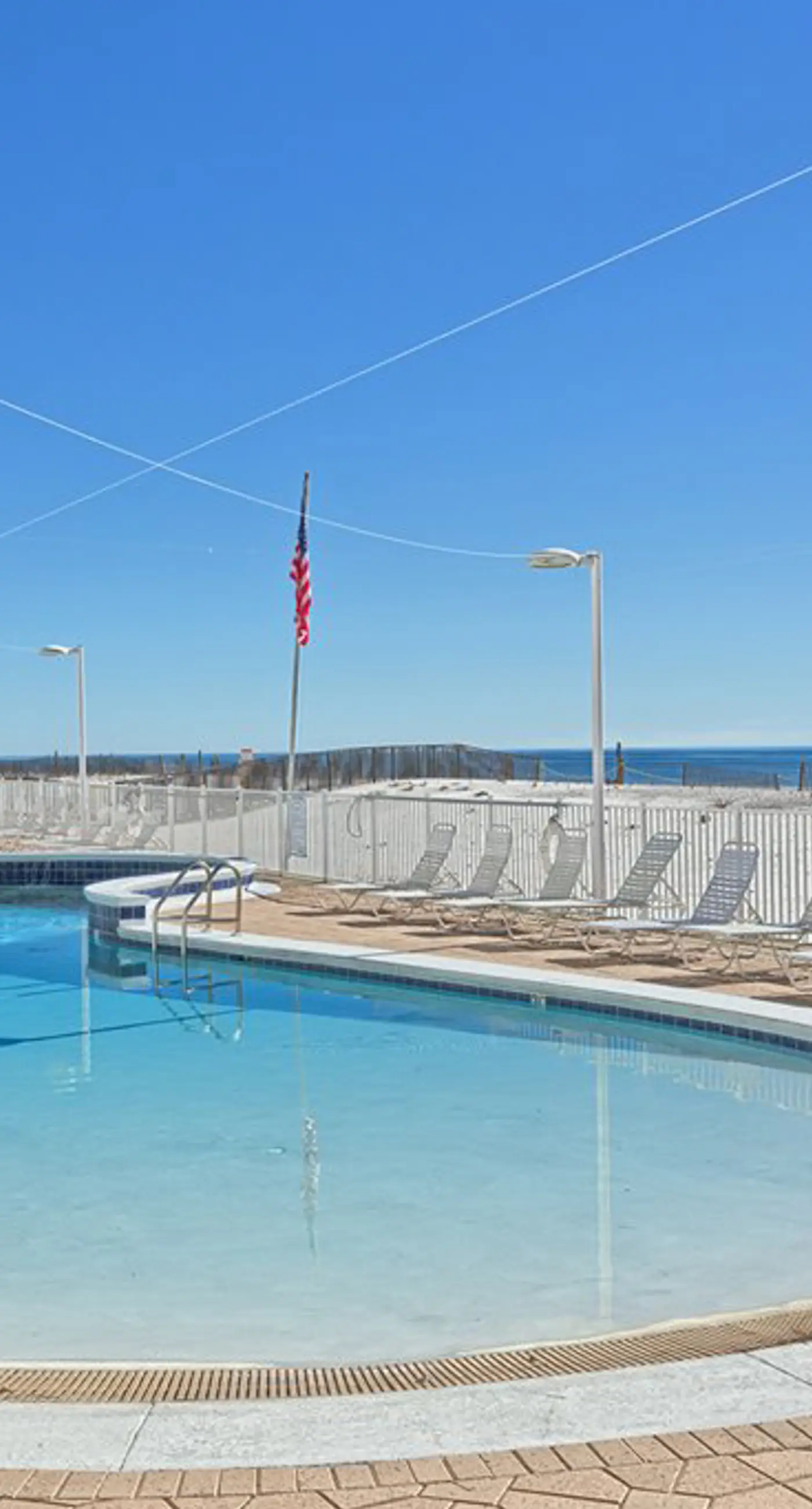 Gulf-front condo with furnished balcony, fast WiFi, pool & fitness room