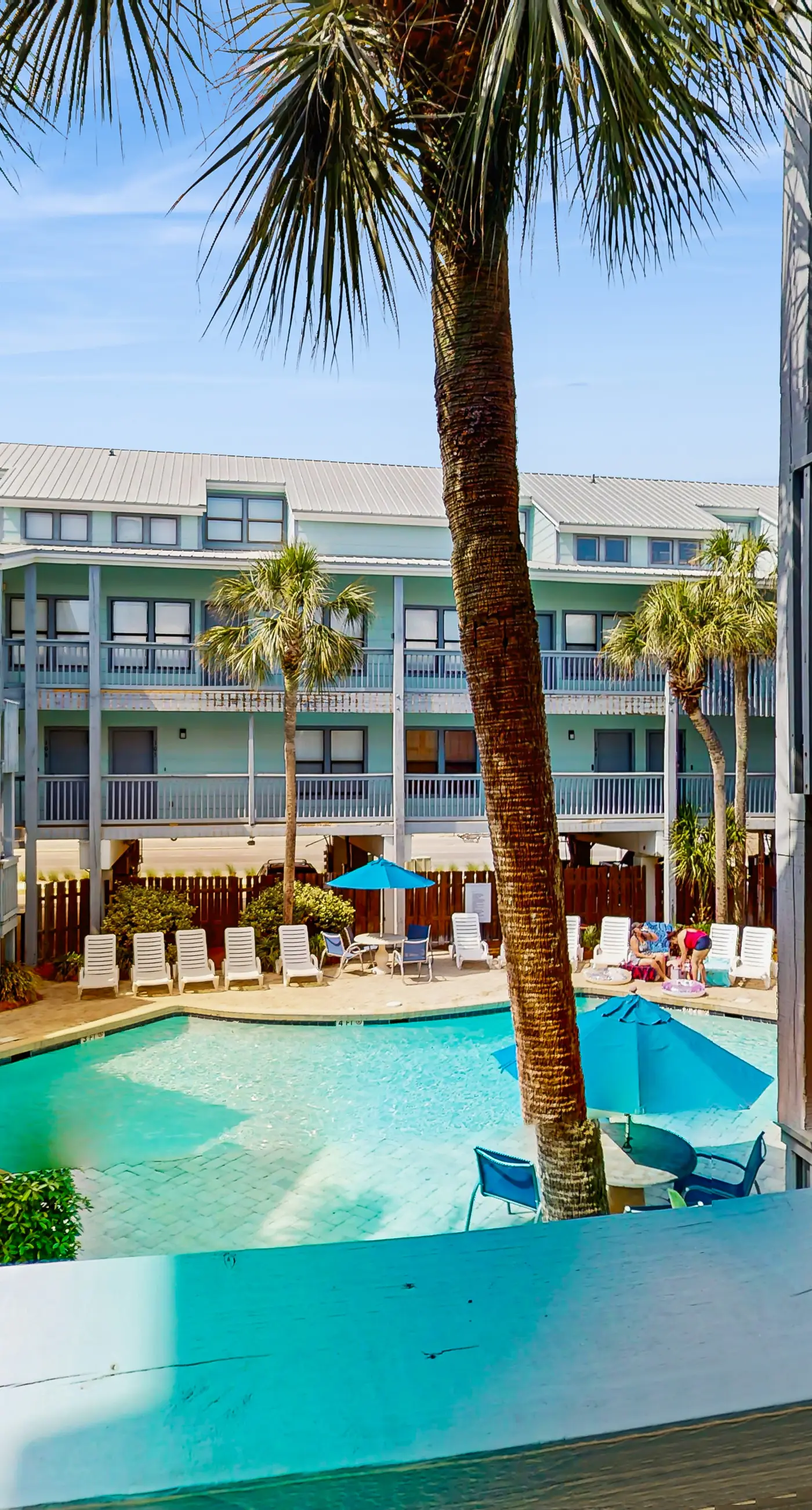 Second Floor Condo with Shared Pool, Fast WiFi, Central AC, and Full Kitchen