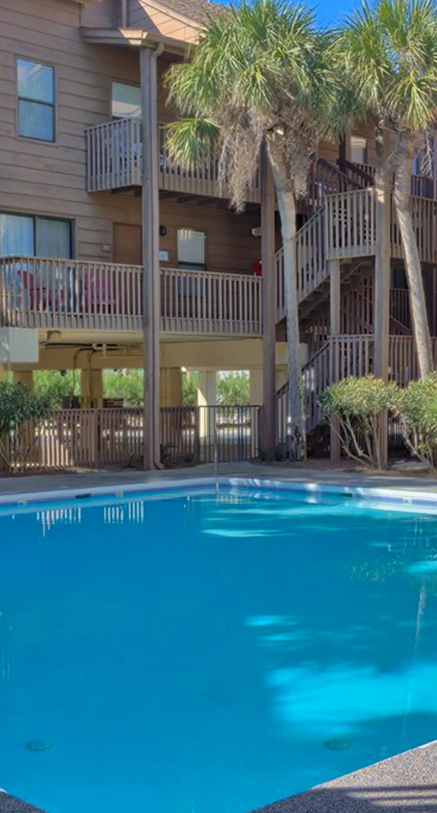 Second Floor Condo with Shared Pool, Fast WiFi, Central AC, and Full Kitchen