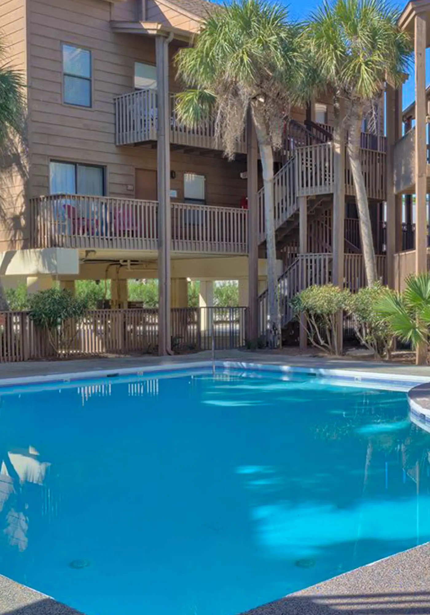 Second Floor Condo with Shared Pool, Fast WiFi, Central AC, and Full Kitchen