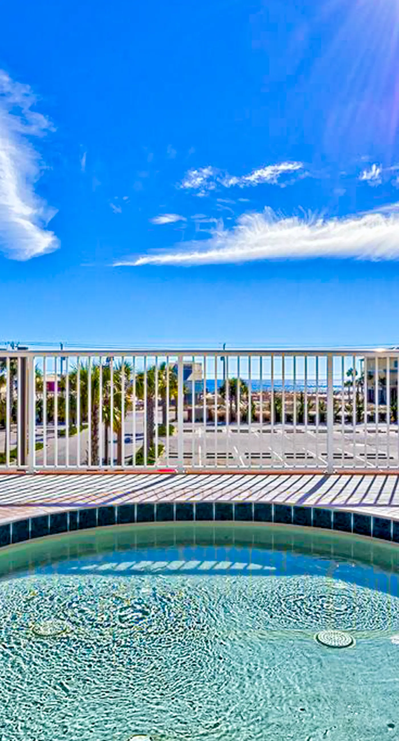 Gulf-view getaway with on-site pool, hot tub, sauna, and fitness center