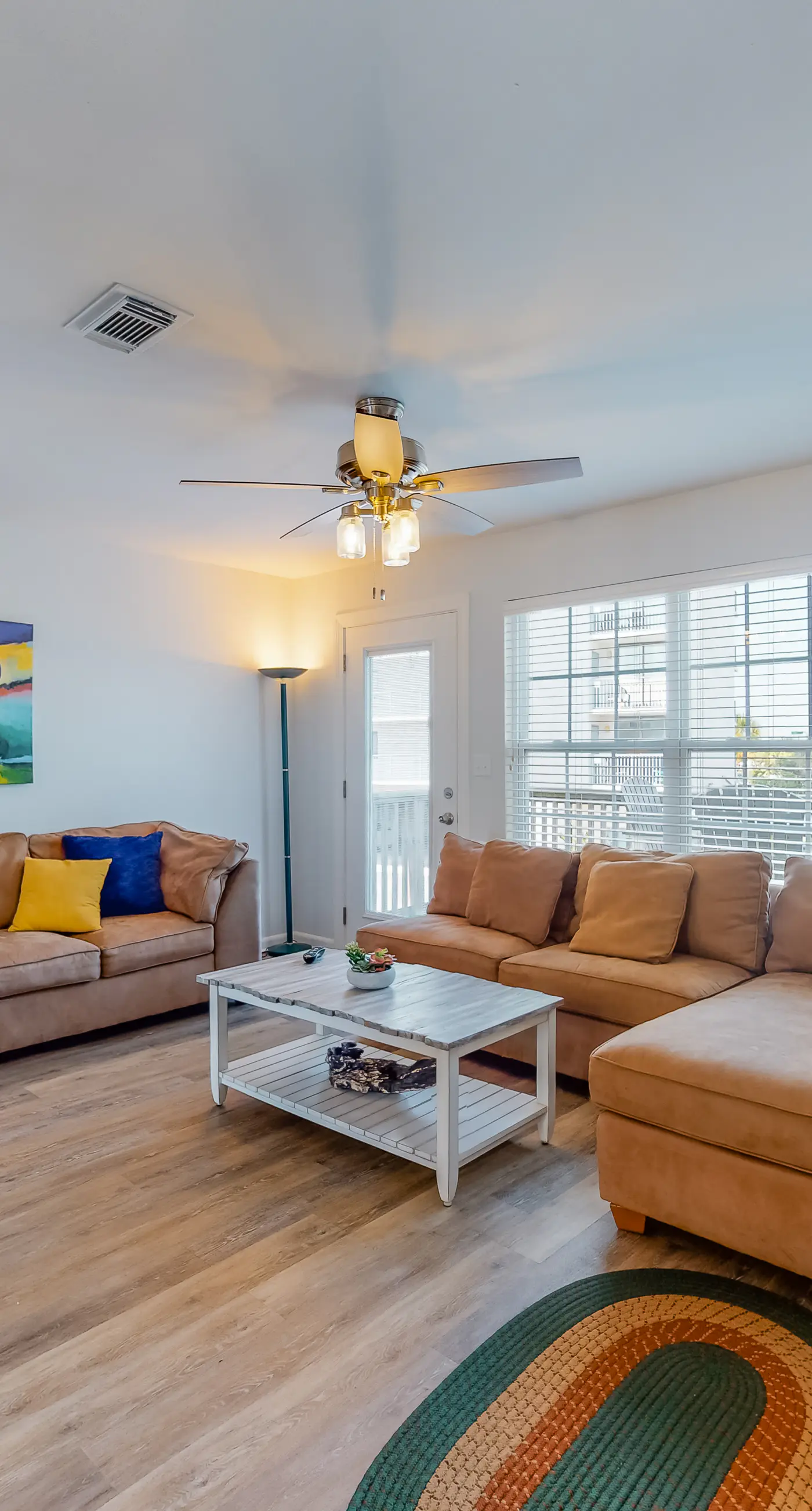 Modern waterfront condo with balcony & outdoor pool - beach across the street