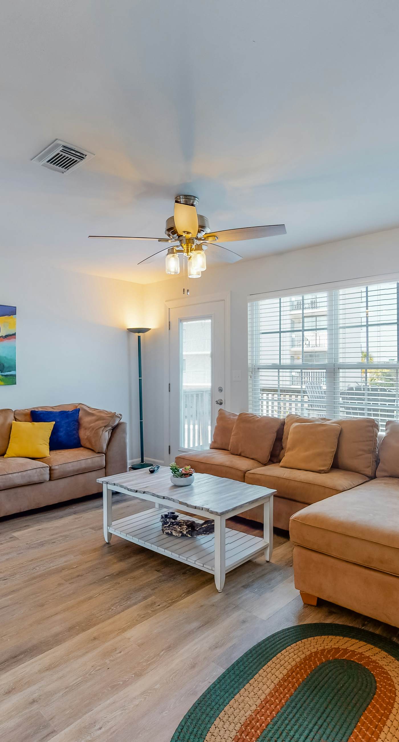 Modern waterfront condo with balcony & outdoor pool - beach across the street