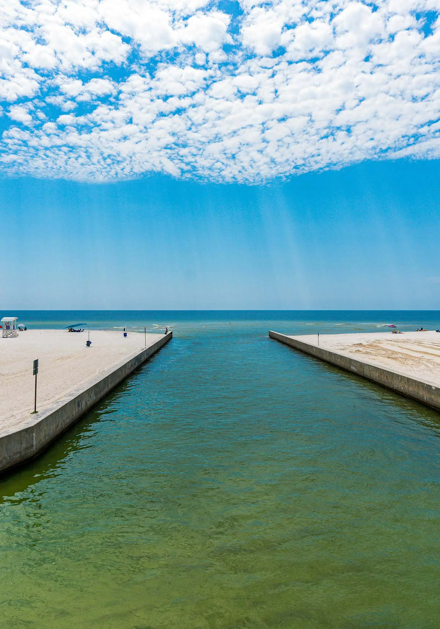 Modern waterfront condo with balcony & outdoor pool - beach across the street