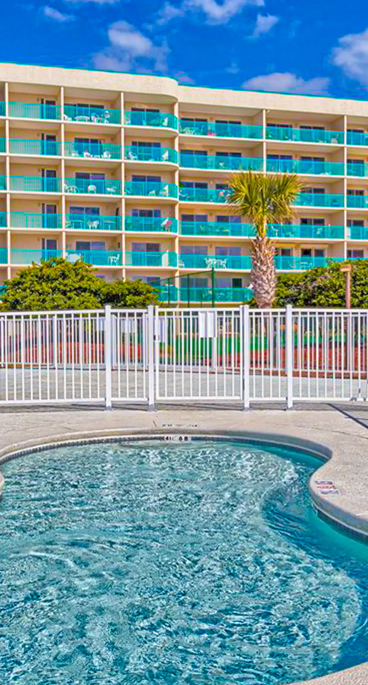Gulf-view condo with 4 pools, hot tubs, beach access, central AC, & washer/dryer
