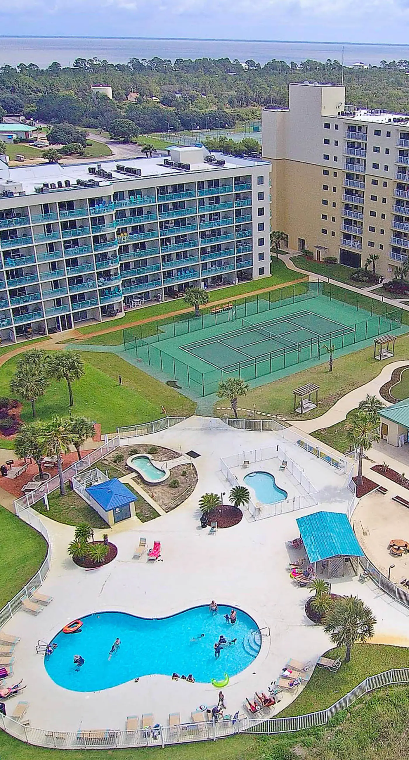 Gulf-view condo with 4 pools, hot tubs, beach access, central AC, & washer/dryer