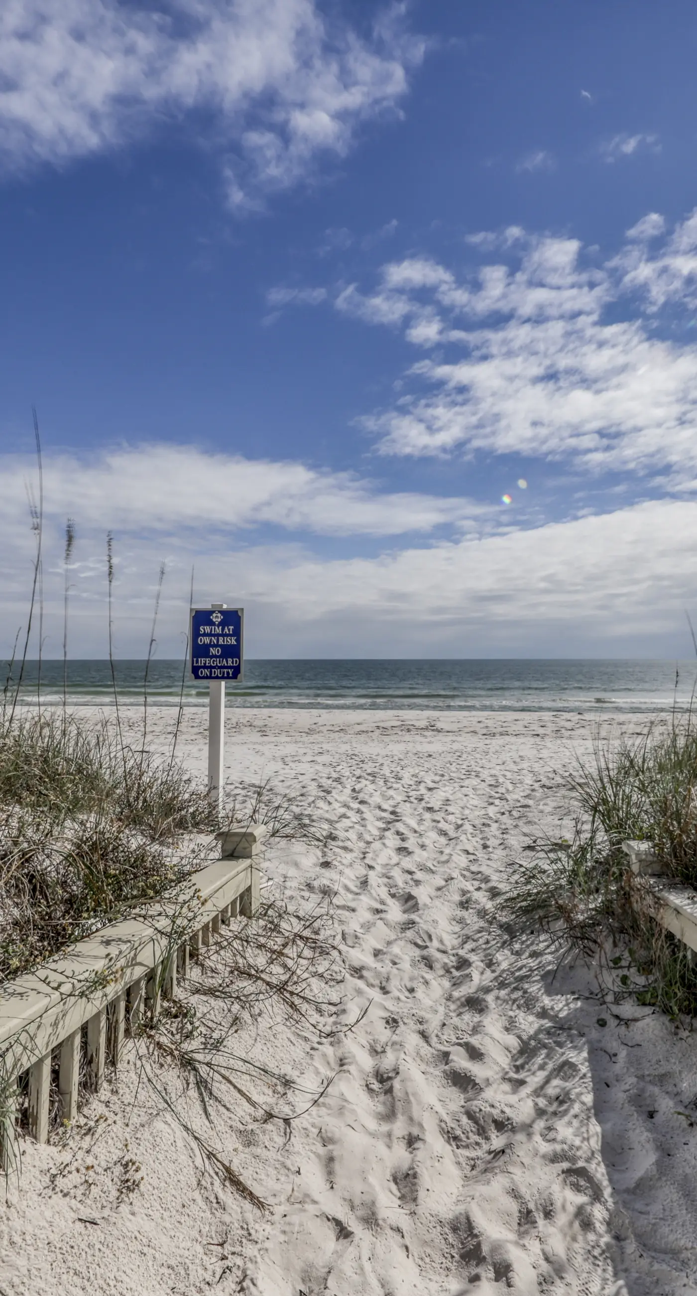 Dog-friendly home with beach access, outdoor pool, and tennis - gated community