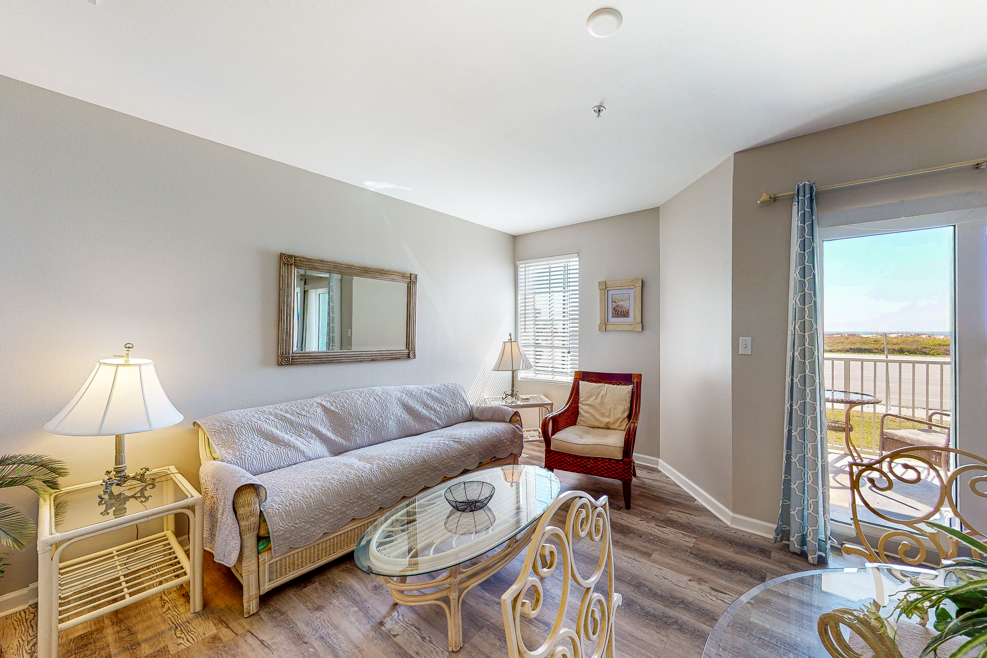 Convenient condo w/ private balcony, beach views, shared pool & AC